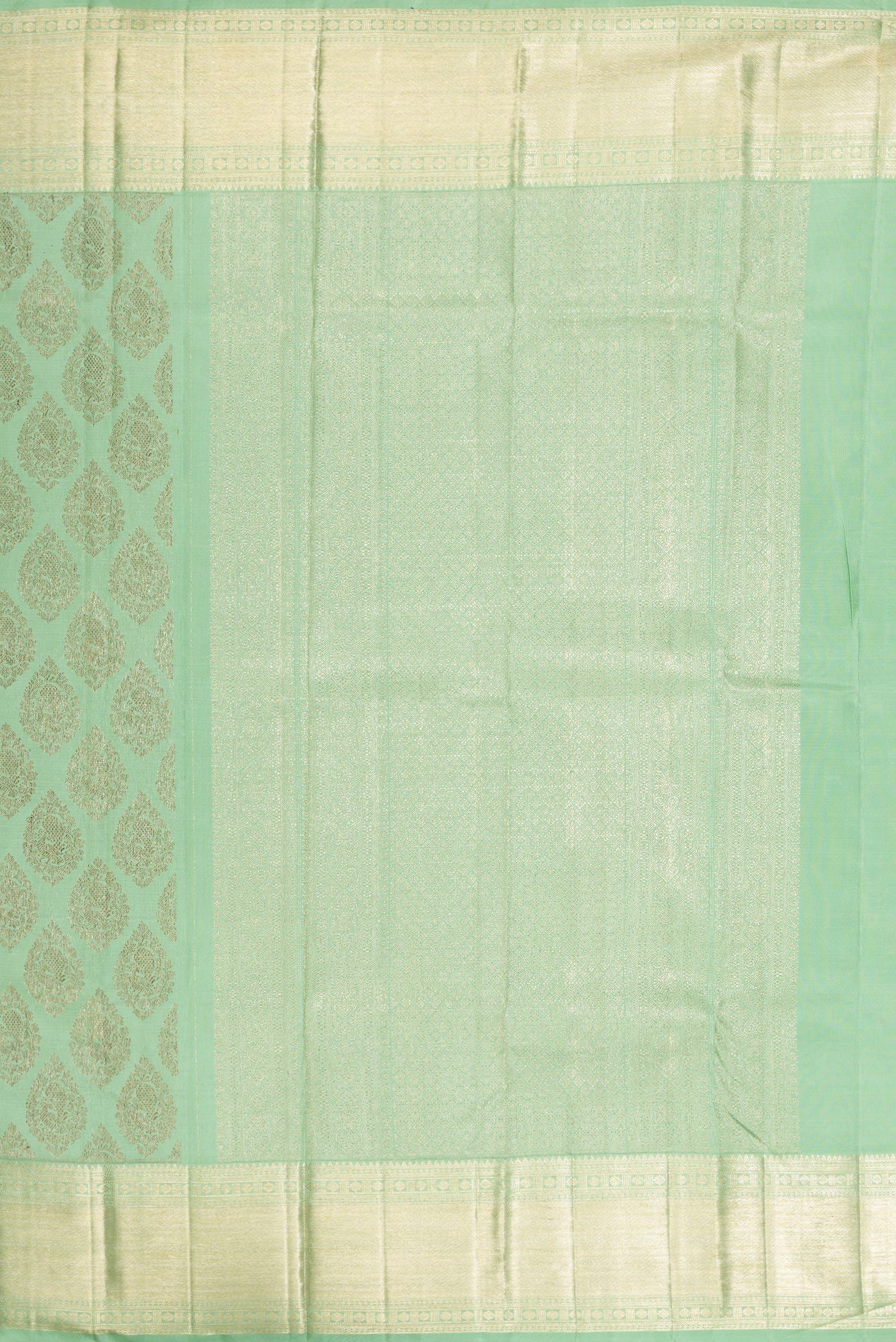 Close up image of the pallu of Light Green Kanchipuram Silk Saree with Zari Brocade on the body and Zari Border. 