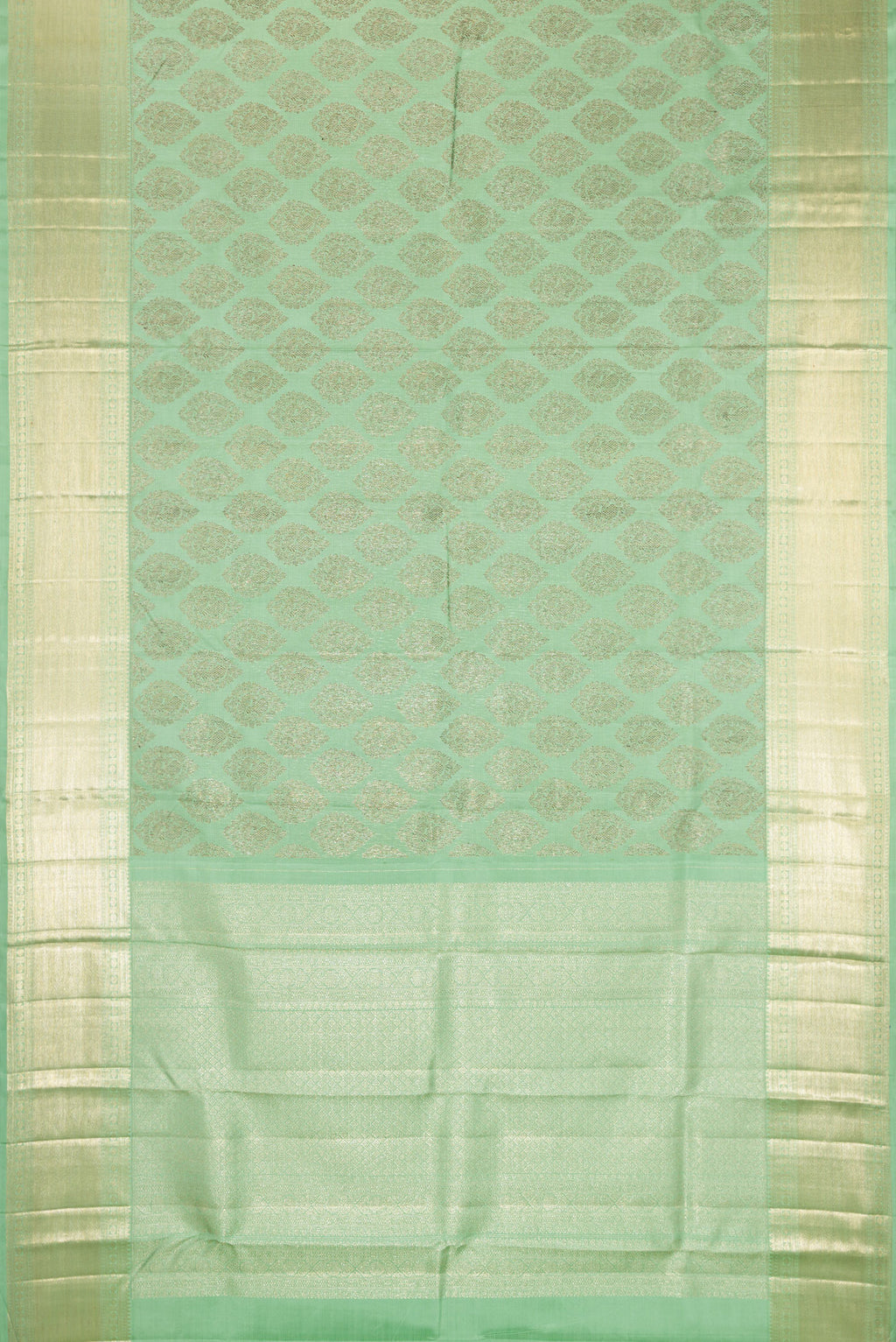 Flat view of Light Green Kanchipuram Silk Saree with Zari Brocade on the body and Zari Border. 