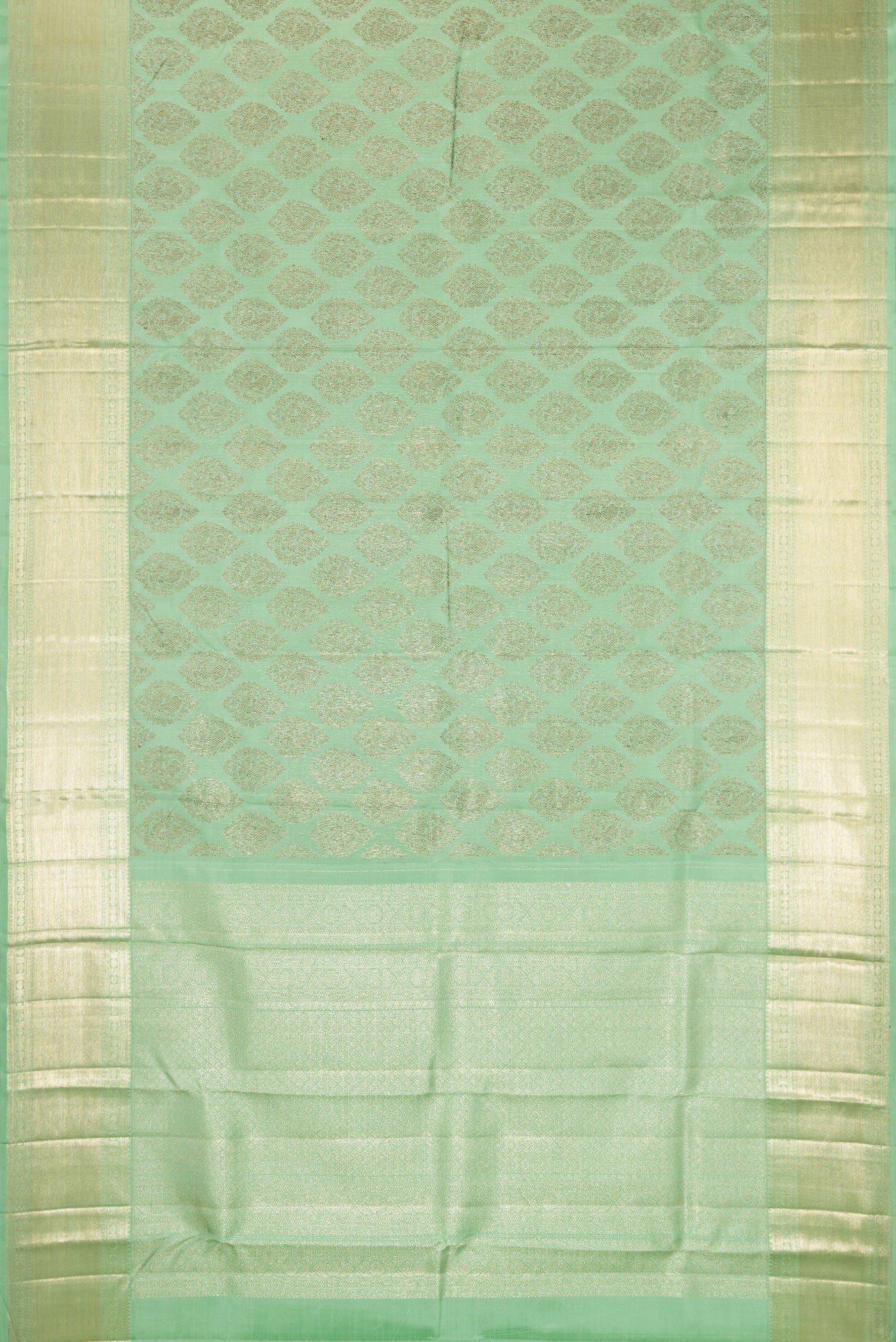 Flat view of Light Green Kanchipuram Silk Saree with Zari Brocade on the body and Zari Border. 