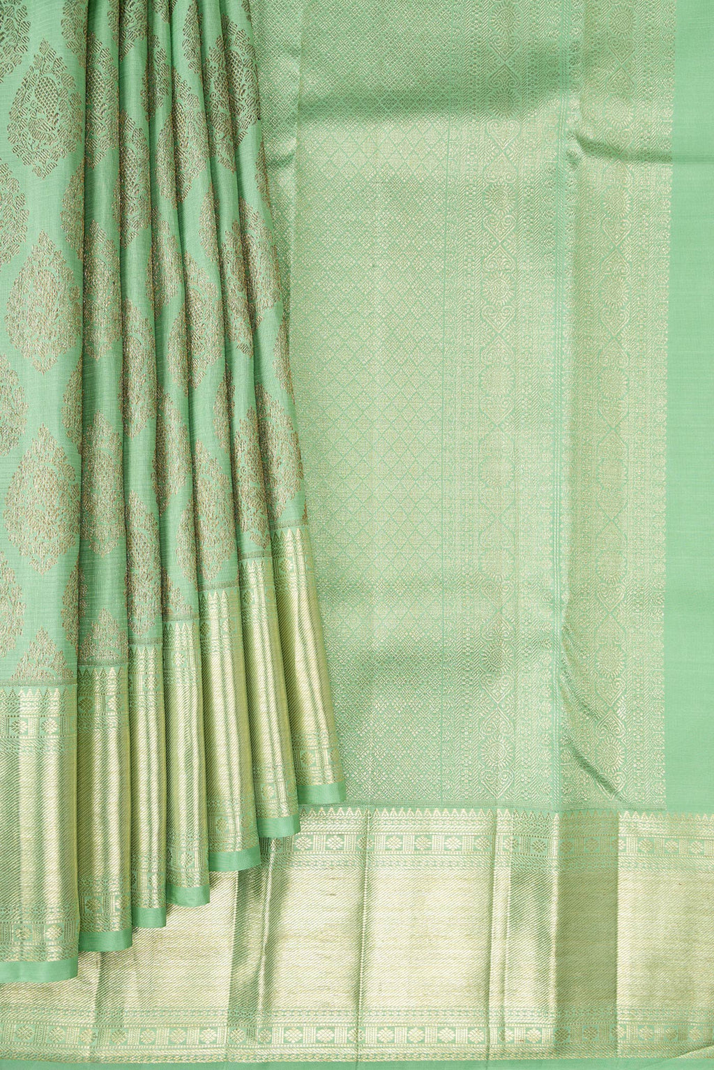 Pleats and pallu of Light Green Kanchipuram Silk Saree with Zari Brocade on the body and Zari Border. 