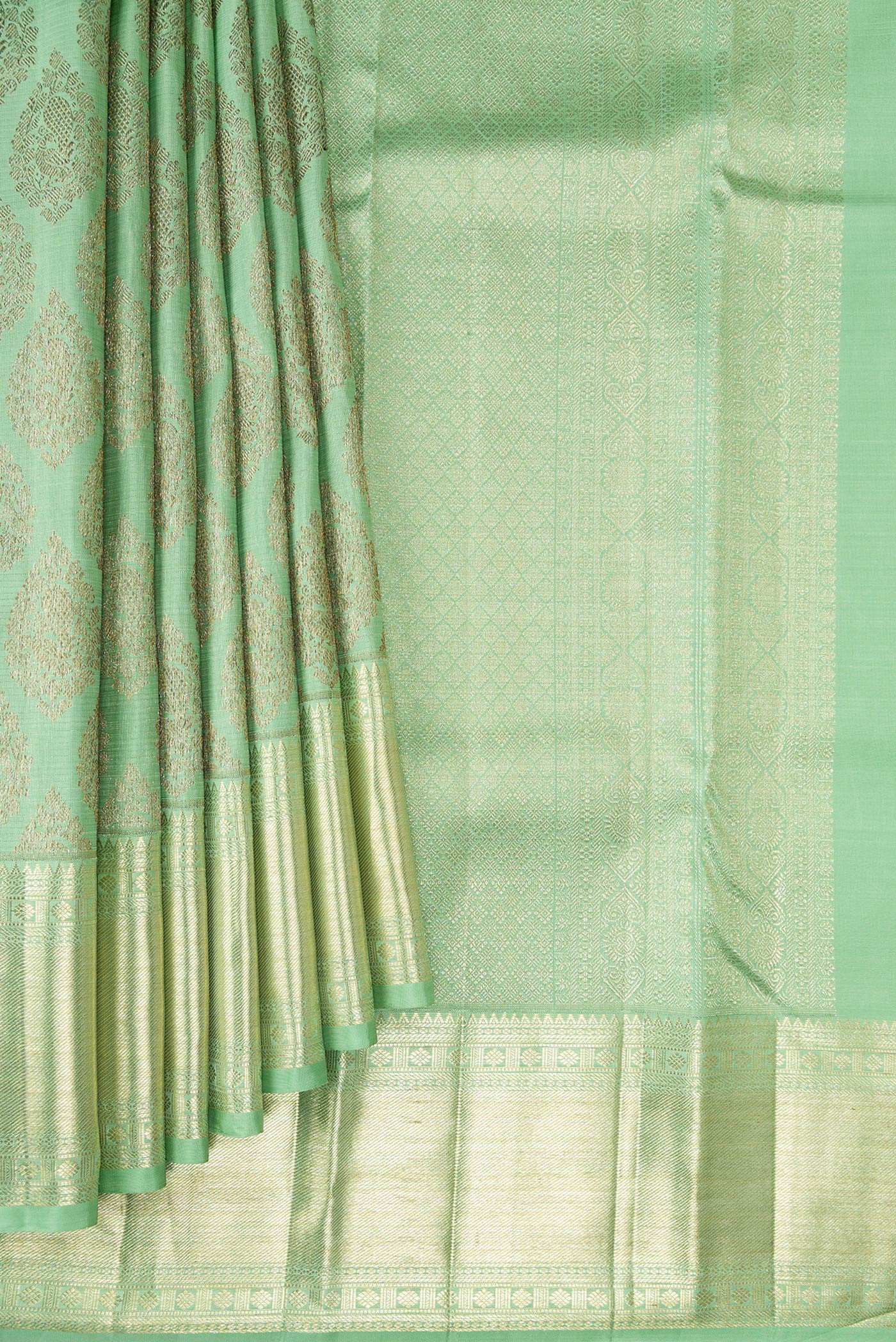 Pleats and pallu of Light Green Kanchipuram Silk Saree with Zari Brocade on the body and Zari Border. 