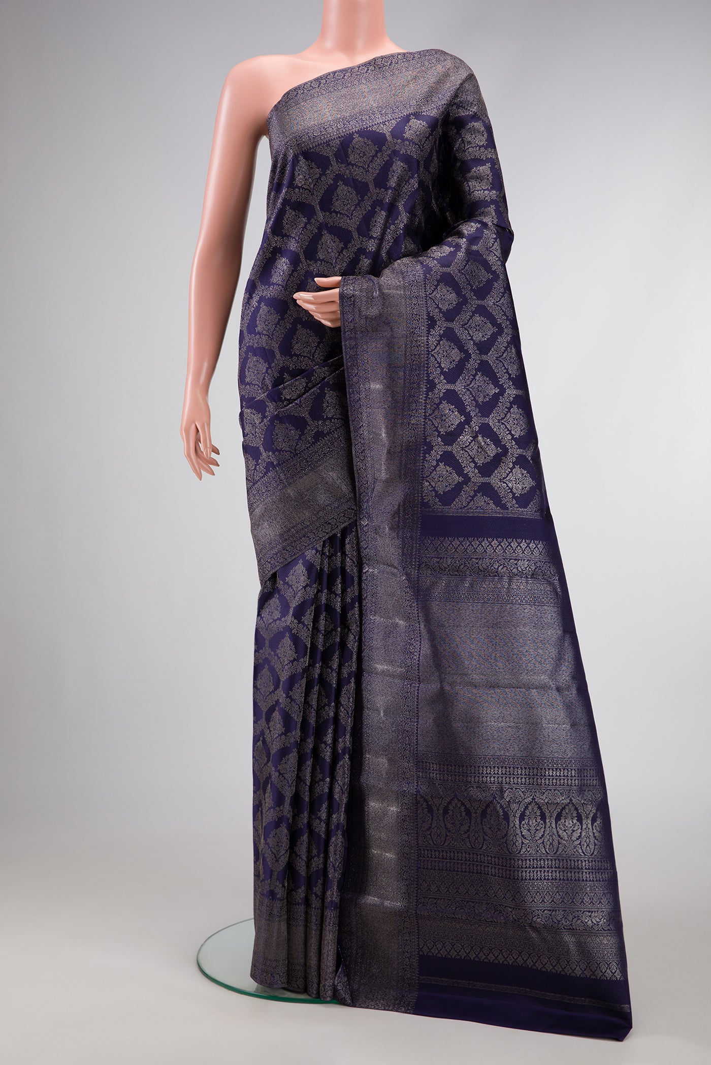 Navy Blue Dual Tone Kanjivaram Silk Saree with Zari Brocade on the body and Zari Border.  displayed on a mannequin