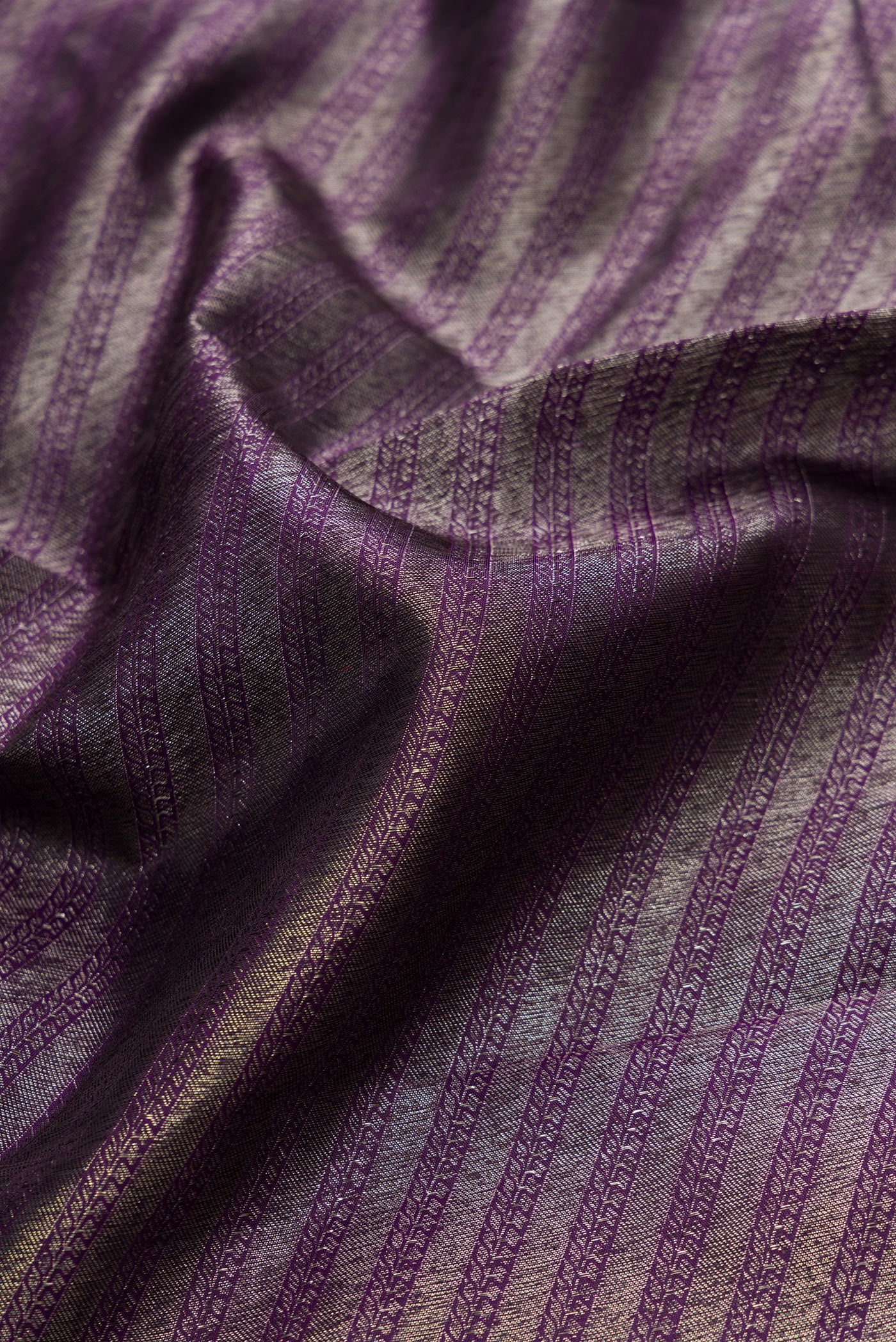 Close up of Violet Dual Tone Kanjivaram Silk Saree with Zari Brocade on the body and Fancy Border.  displaying folds
