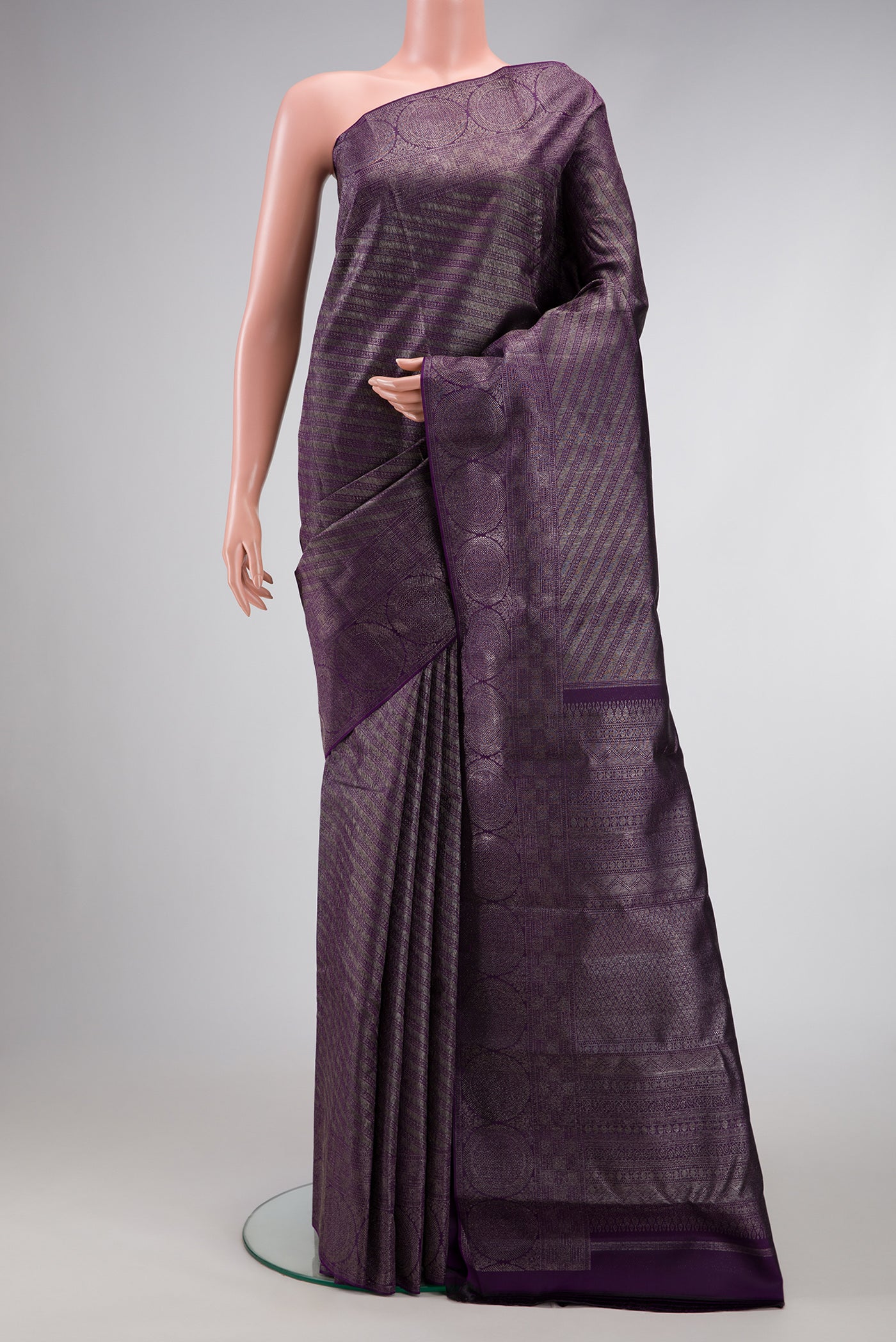 Violet Dual Tone Kanjivaram Silk Saree with Zari Brocade on the body and Fancy Border.  displayed on a mannequin