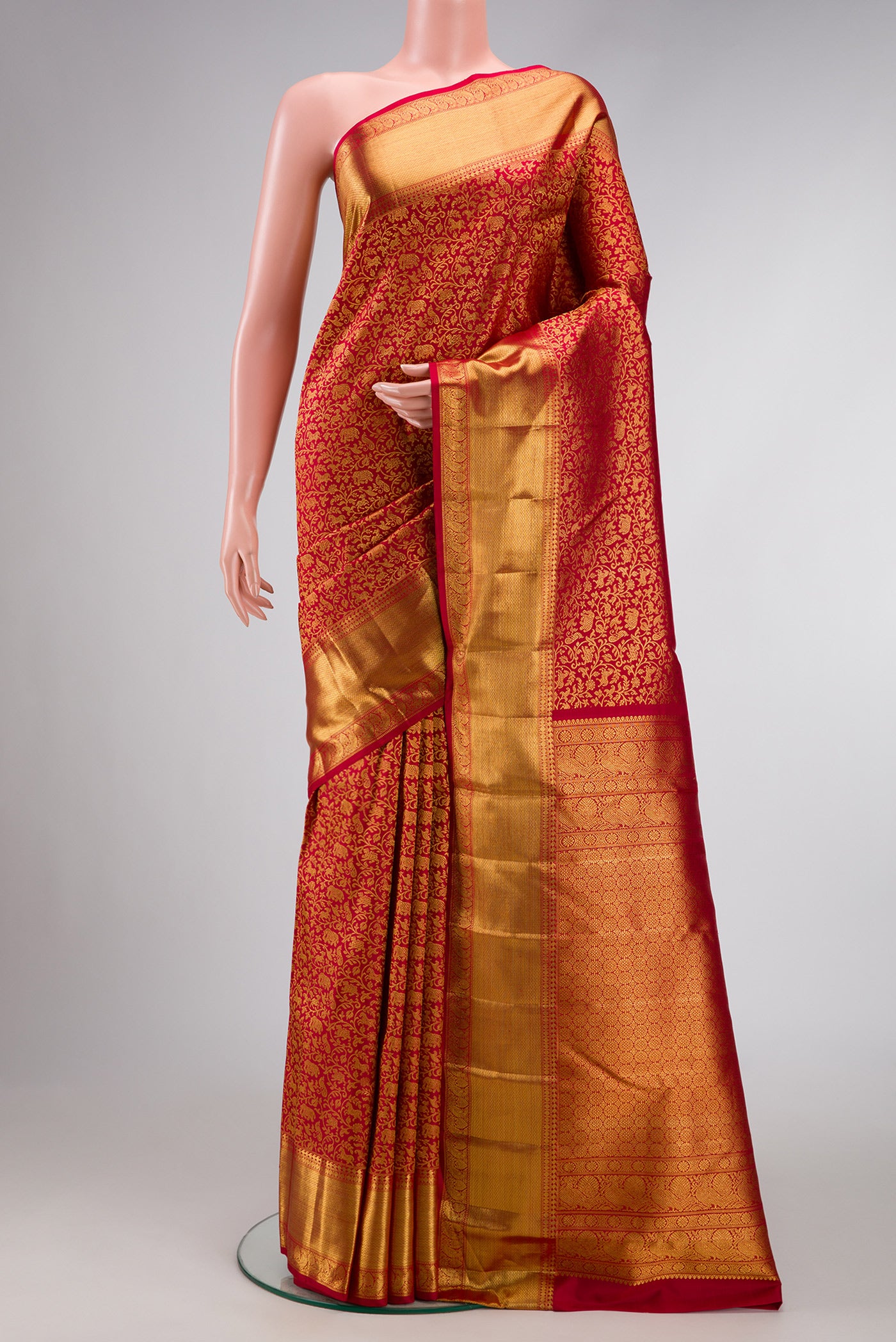 Maroon Dual Tone Kanchipuram Silk Saree with Zari Brocade on the body and Zari Border.  displayed on a mannequin