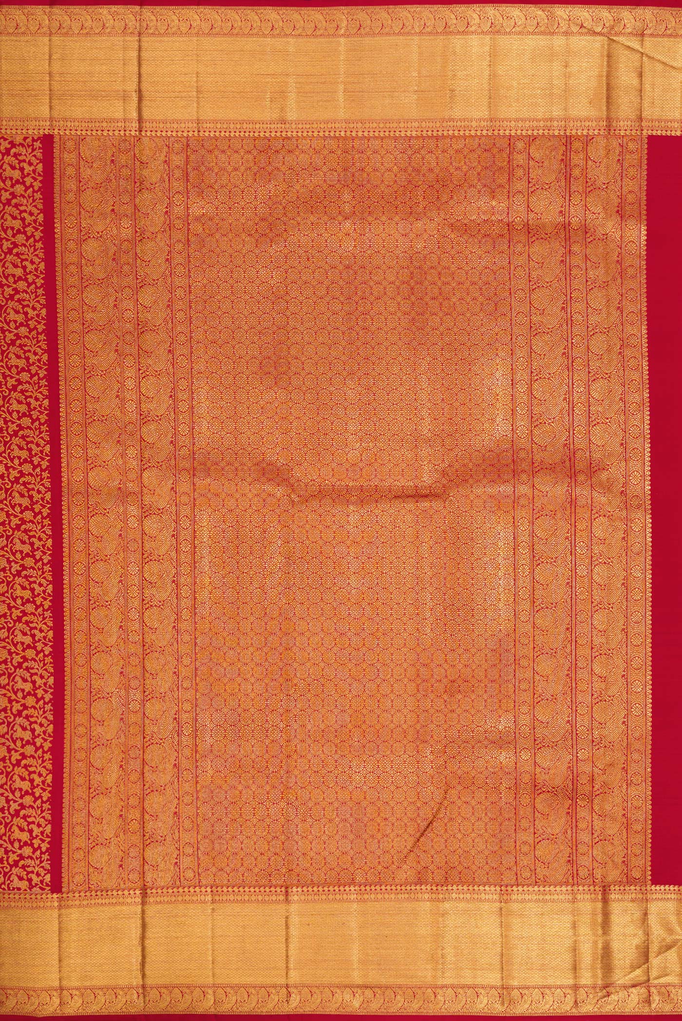 Close up image of the pallu of Maroon Dual Tone Kanchipuram Silk Saree with Zari Brocade on the body and Zari Border. 
