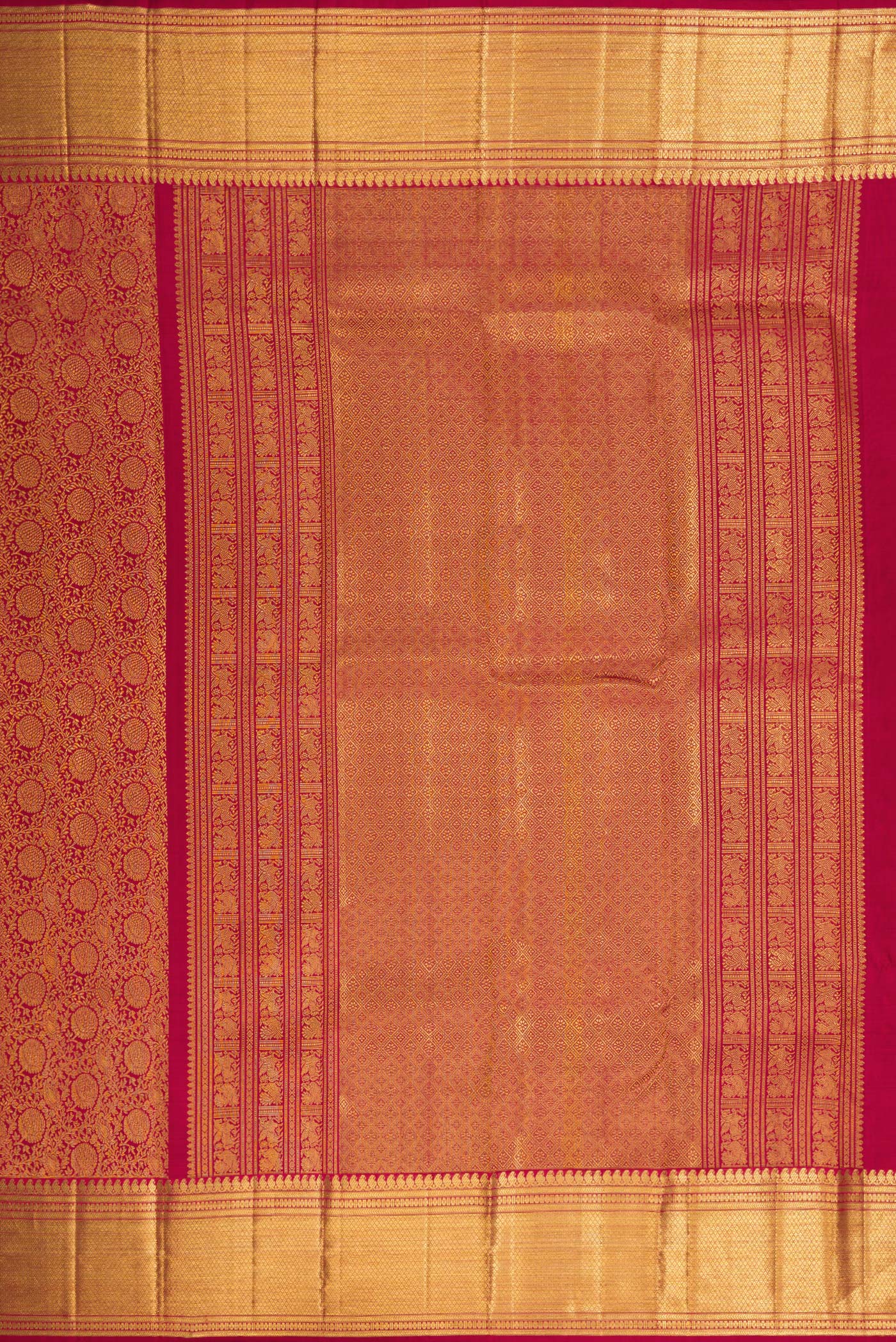 Close up image of the pallu of Maroon Dual Tone Kanchipuram Silk Saree with Zari Brocade on the body and Zari Border. 