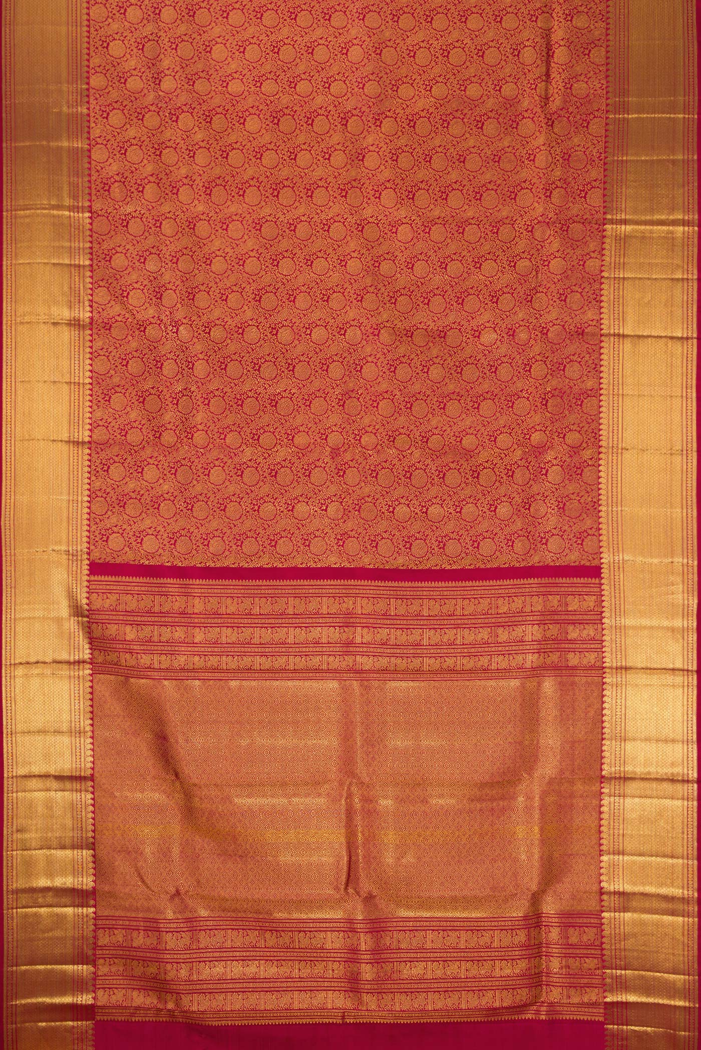 Flat view of Maroon Dual Tone Kanchipuram Silk Saree with Zari Brocade on the body and Zari Border. 