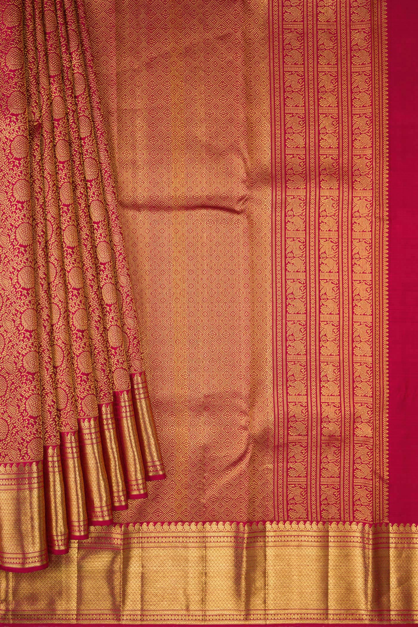 Pleats and pallu of Maroon Dual Tone Kanchipuram Silk Saree with Zari Brocade on the body and Zari Border. 