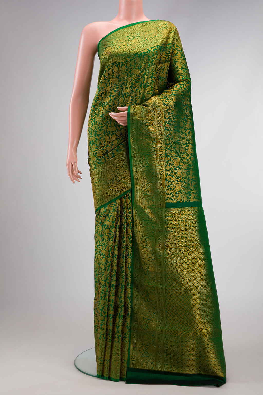 Green Dual Tone Kanchipuram Silk Saree with Zari Brocade on the body and Zari Border.  displayed on a mannequin