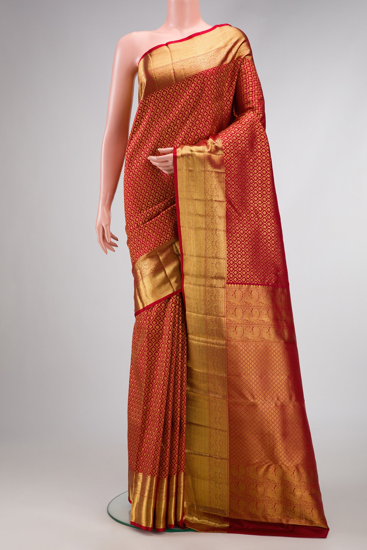 Red Dual Tone Kanchipuram Silk Saree with Zari Brocade on the body and Zari Border.  displayed on a mannequin