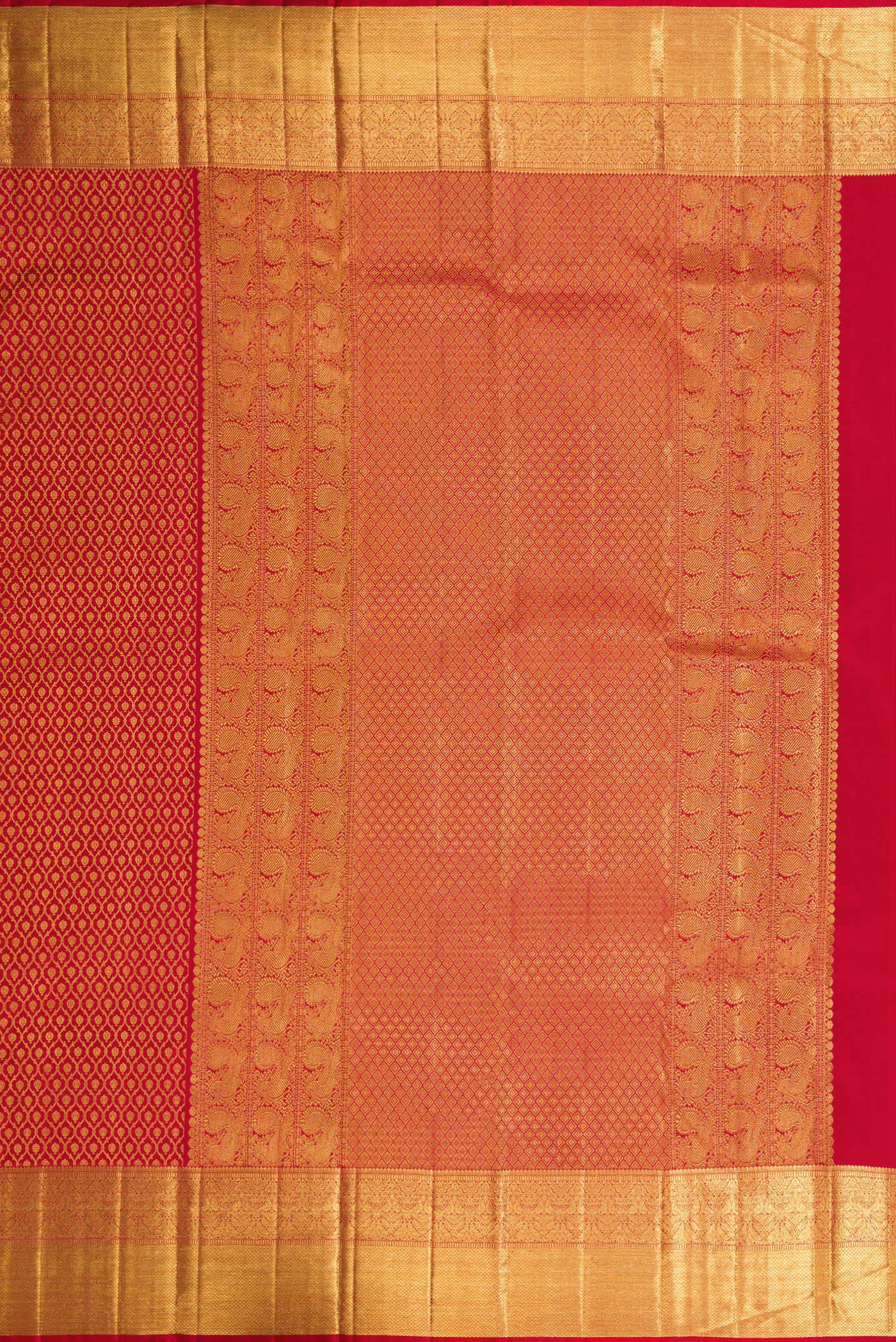 Close up image of the pallu of Red Dual Tone Kanchipuram Silk Saree with Zari Brocade on the body and Zari Border. 