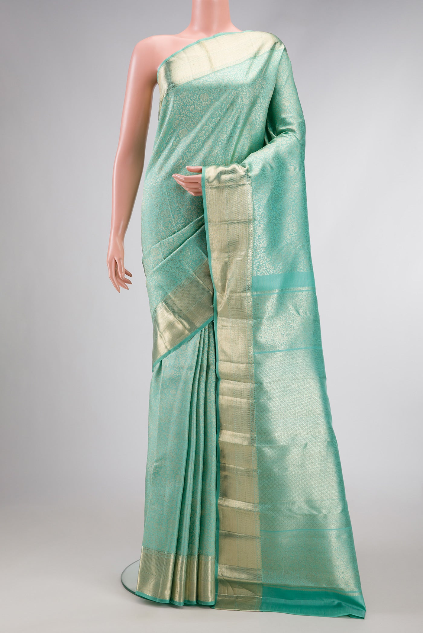 Light Blue Dual Tone Kanchipuram Silk Saree with Zari Brocade on the body and Zari Border.  displayed on a mannequin