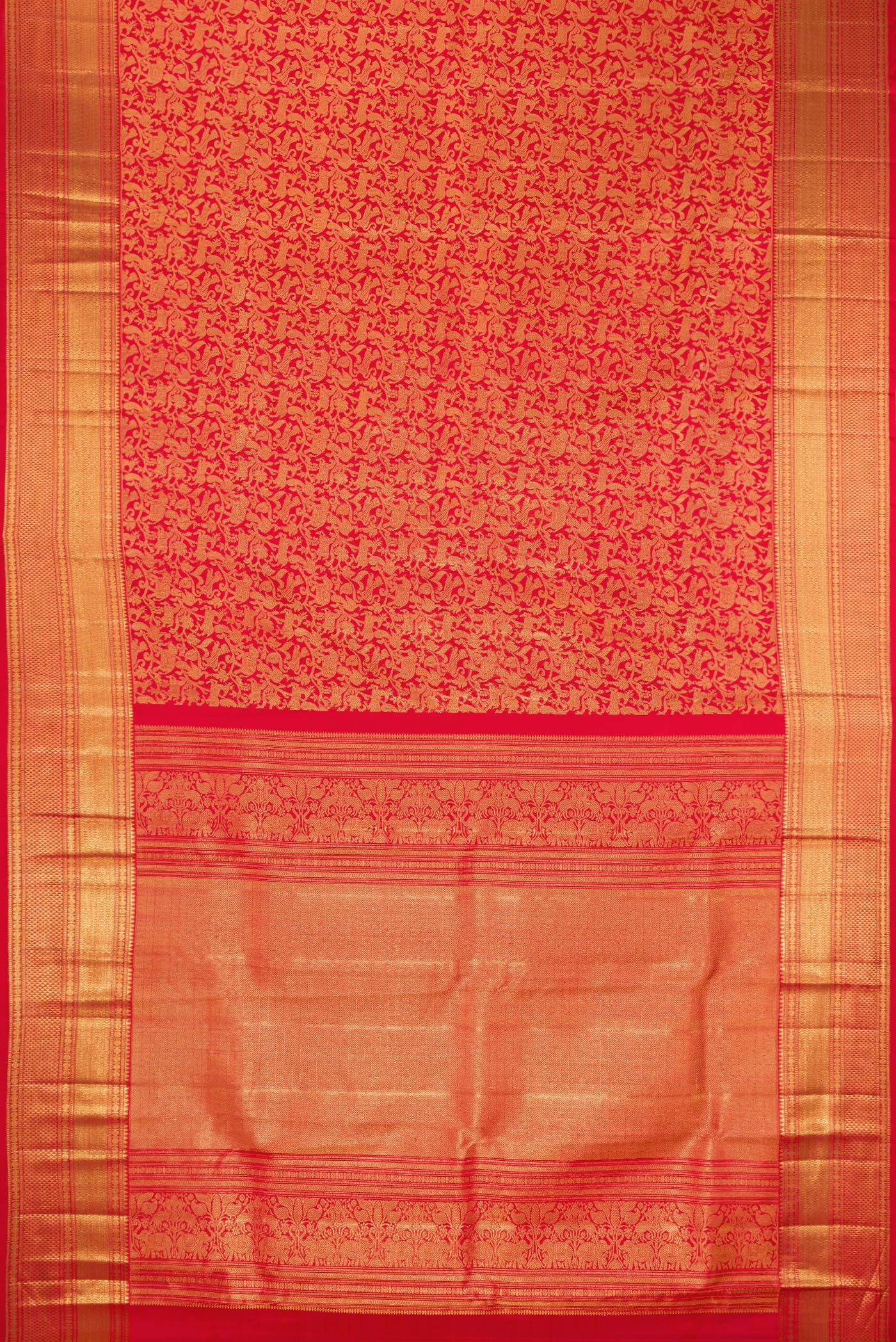 Flat view of Red Kanchipuram Silk Saree with Zari Brocade on the body and Zari Border. 