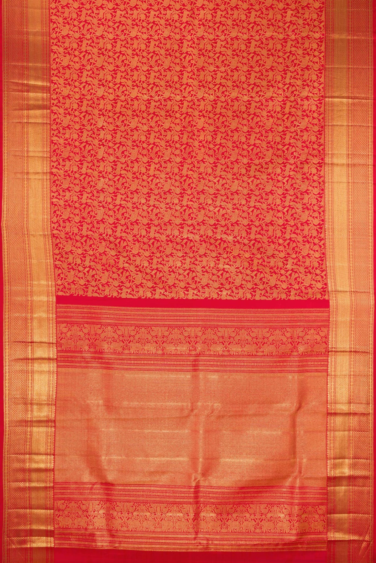 Flat view of Red Kanchipuram Silk Saree with Zari Brocade on the body and Zari Border. 