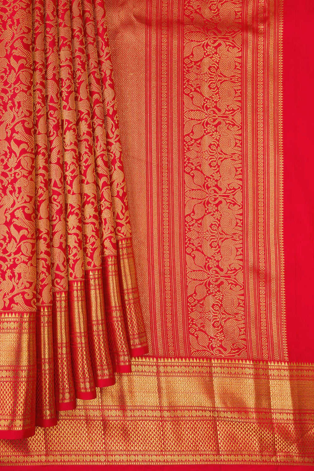 Pleats and pallu of Red Kanchipuram Silk Saree with Zari Brocade on the body and Zari Border. 