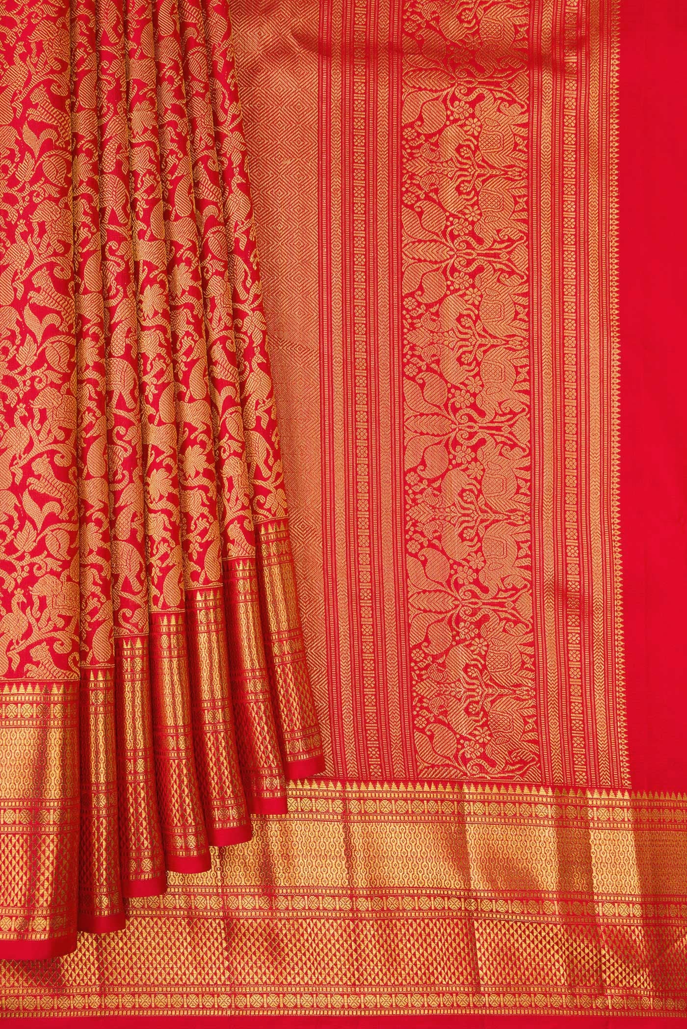 Pleats and pallu of Red Kanchipuram Silk Saree with Zari Brocade on the body and Zari Border. 