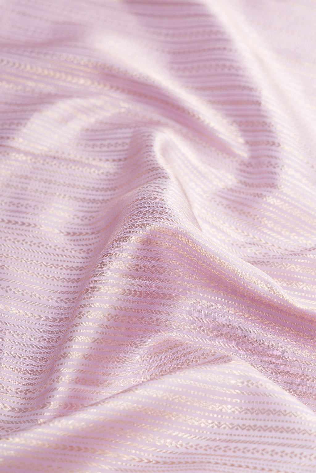 Close up of Lilac Dual Tone Kanchipuram Silk Saree with Zari Brocade on the body and Zari Border.  displaying folds