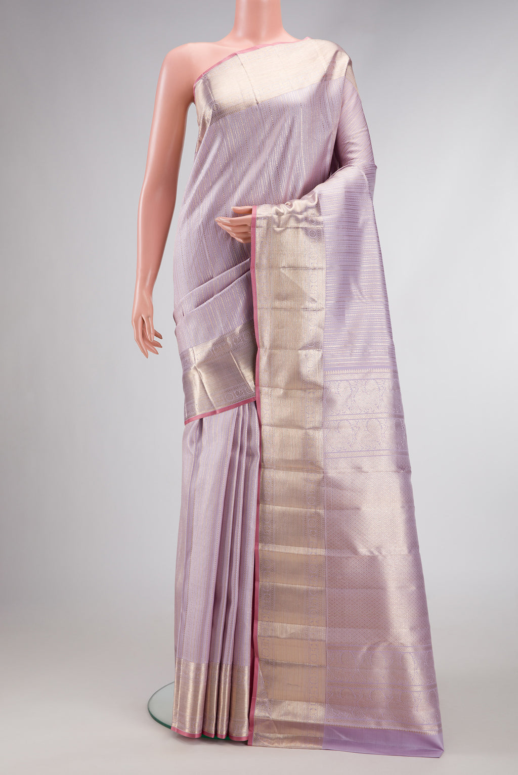 Lilac Dual Tone Kanchipuram Silk Saree with Zari Brocade on the body and Zari Border.  displayed on a mannequin