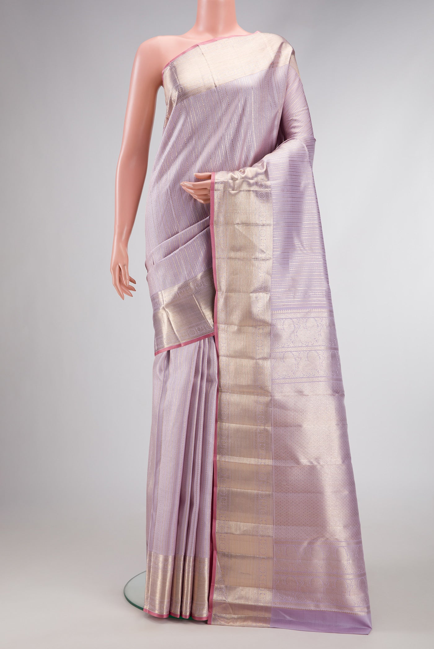 Lilac Dual Tone Kanchipuram Silk Saree with Zari Brocade on the body and Zari Border.  displayed on a mannequin