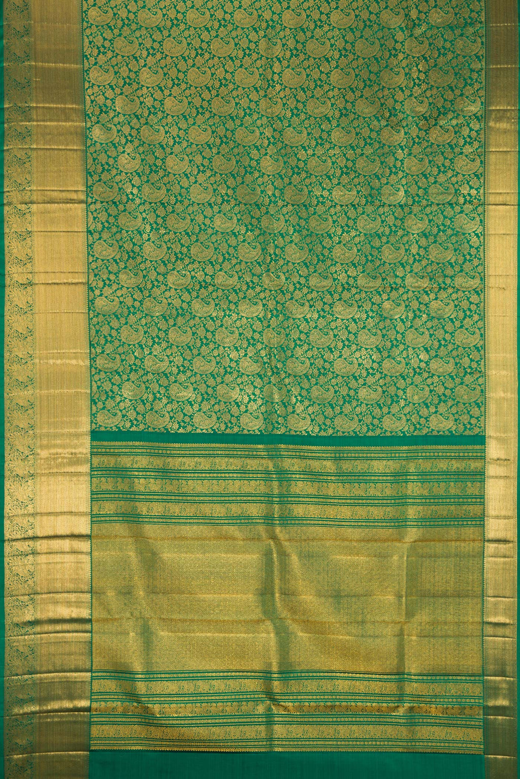 Flat view of Bottle Green Kanchipuram Silk Saree with Zari Brocade on the body and Zari Border. 