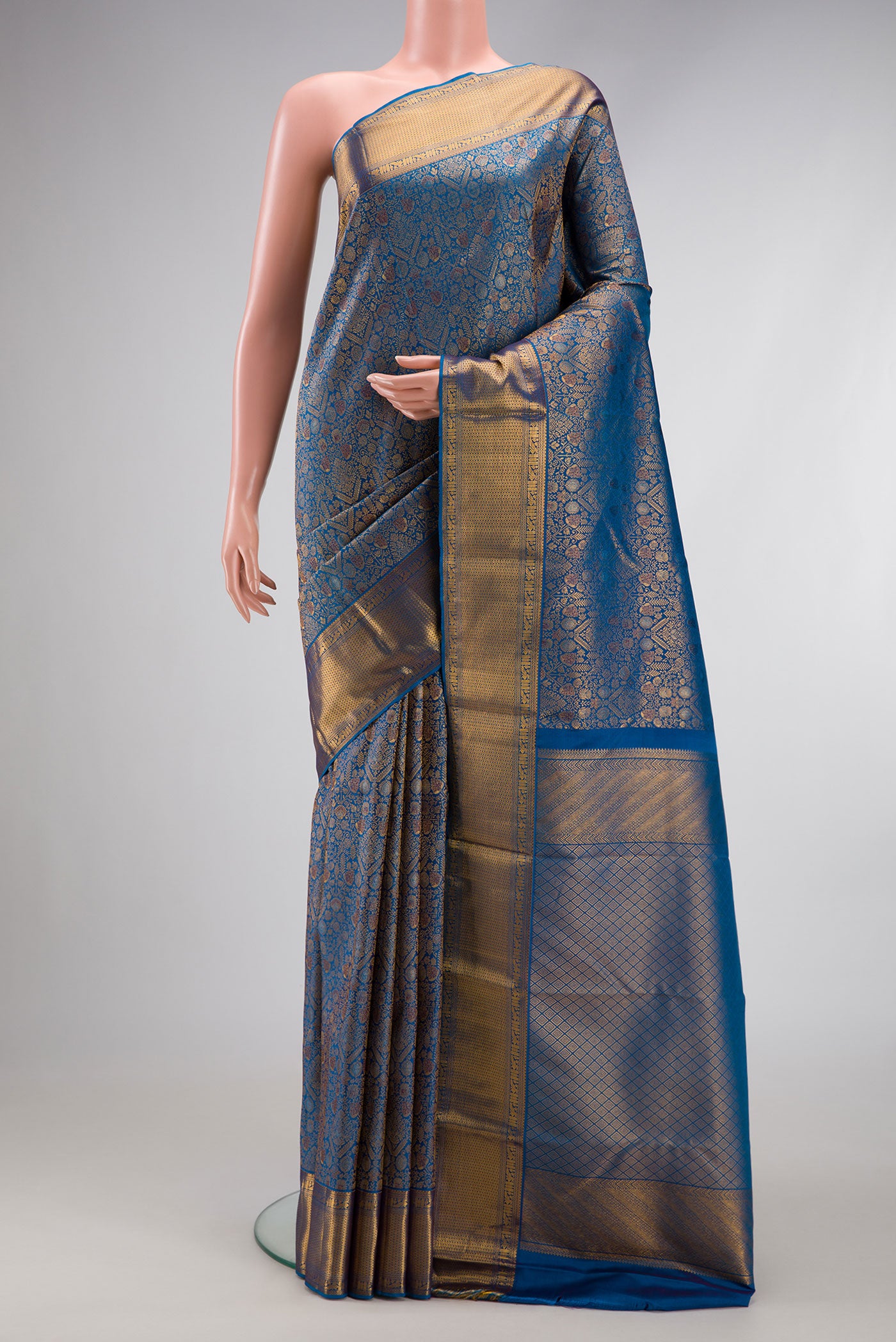 Peacock Blue Dual Tone Kanchipuram Silk Saree with Zari Brocade on the body and Zari Border.  displayed on a mannequin