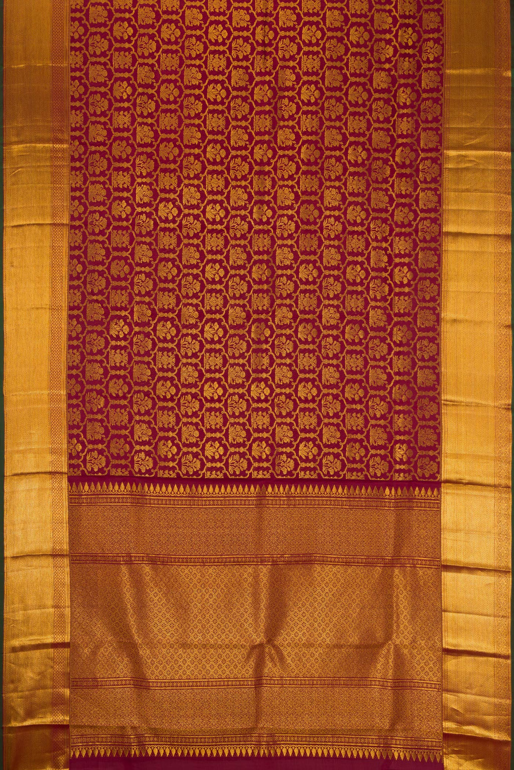 Flat view of Maroon Dual Tone Kanchipuram Silk Saree with Zari Brocade on the body and Zari Border. 