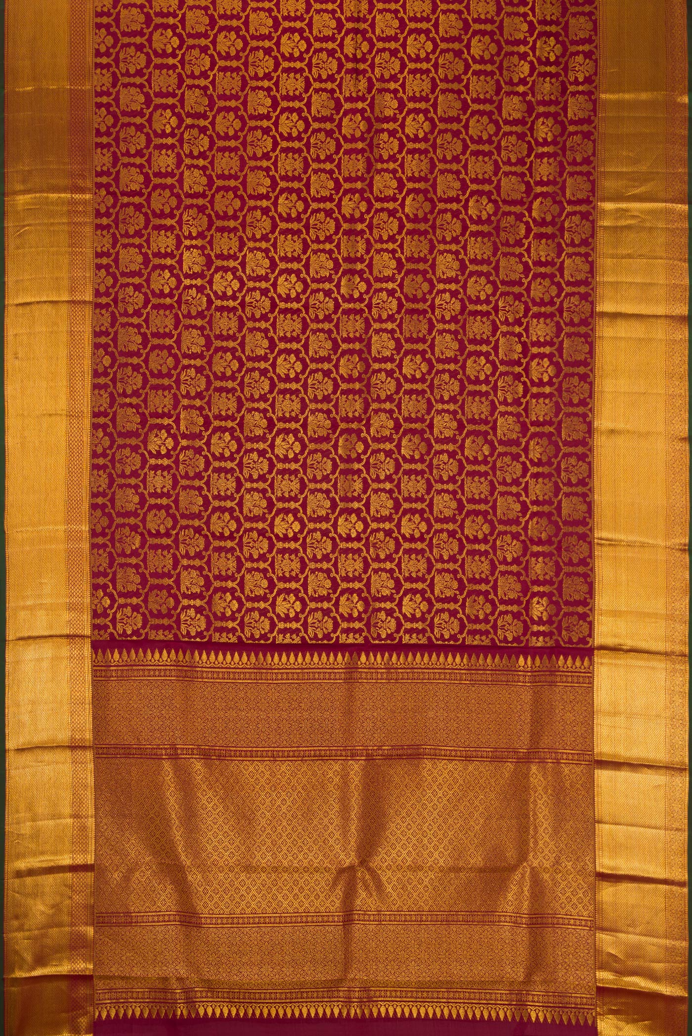 Flat view of Maroon Dual Tone Kanchipuram Silk Saree with Zari Brocade on the body and Zari Border. 