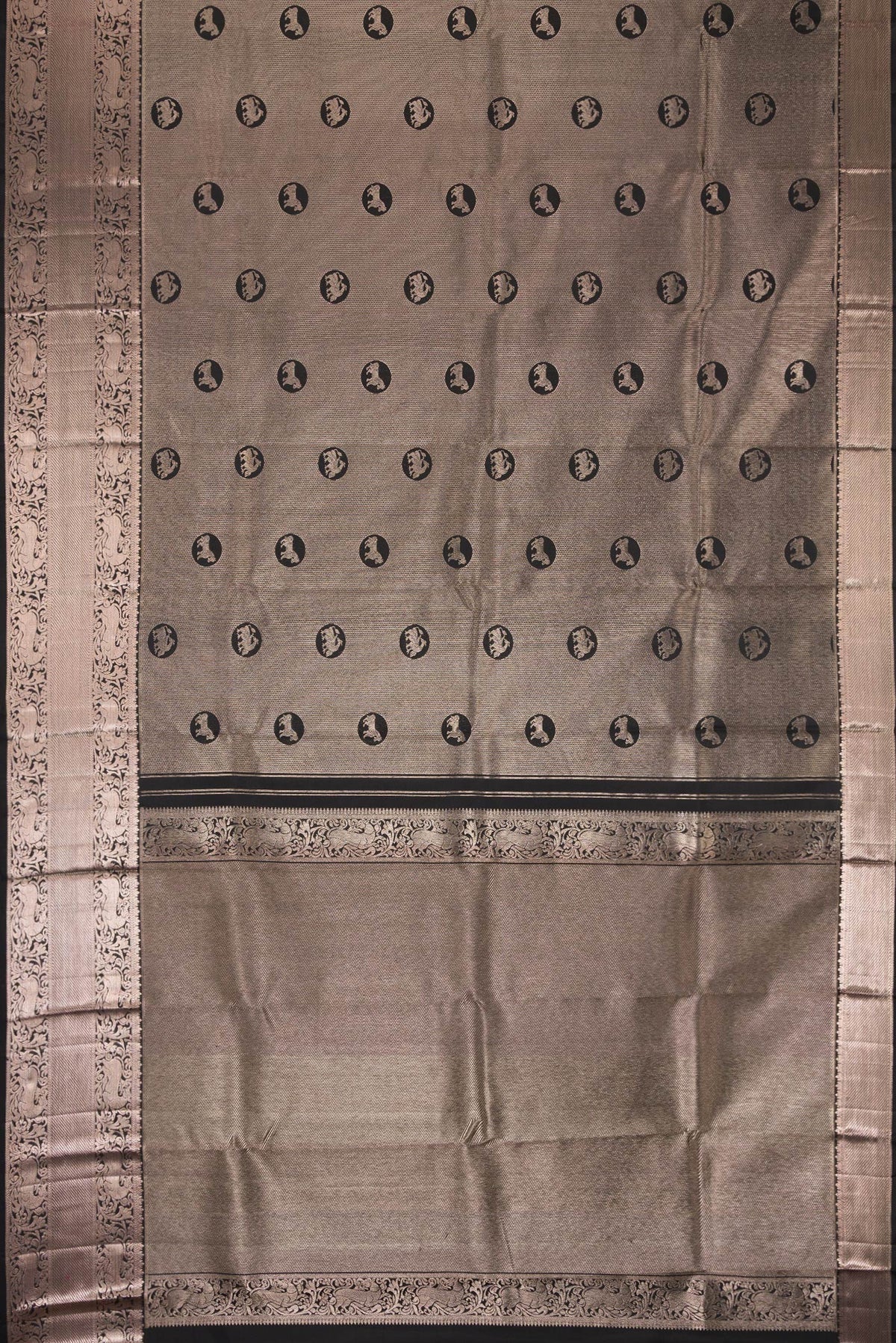 Flat view of Black Dual Tone Kanchipuram Silk Saree with Zari Brocade on the body and Zari Border. 