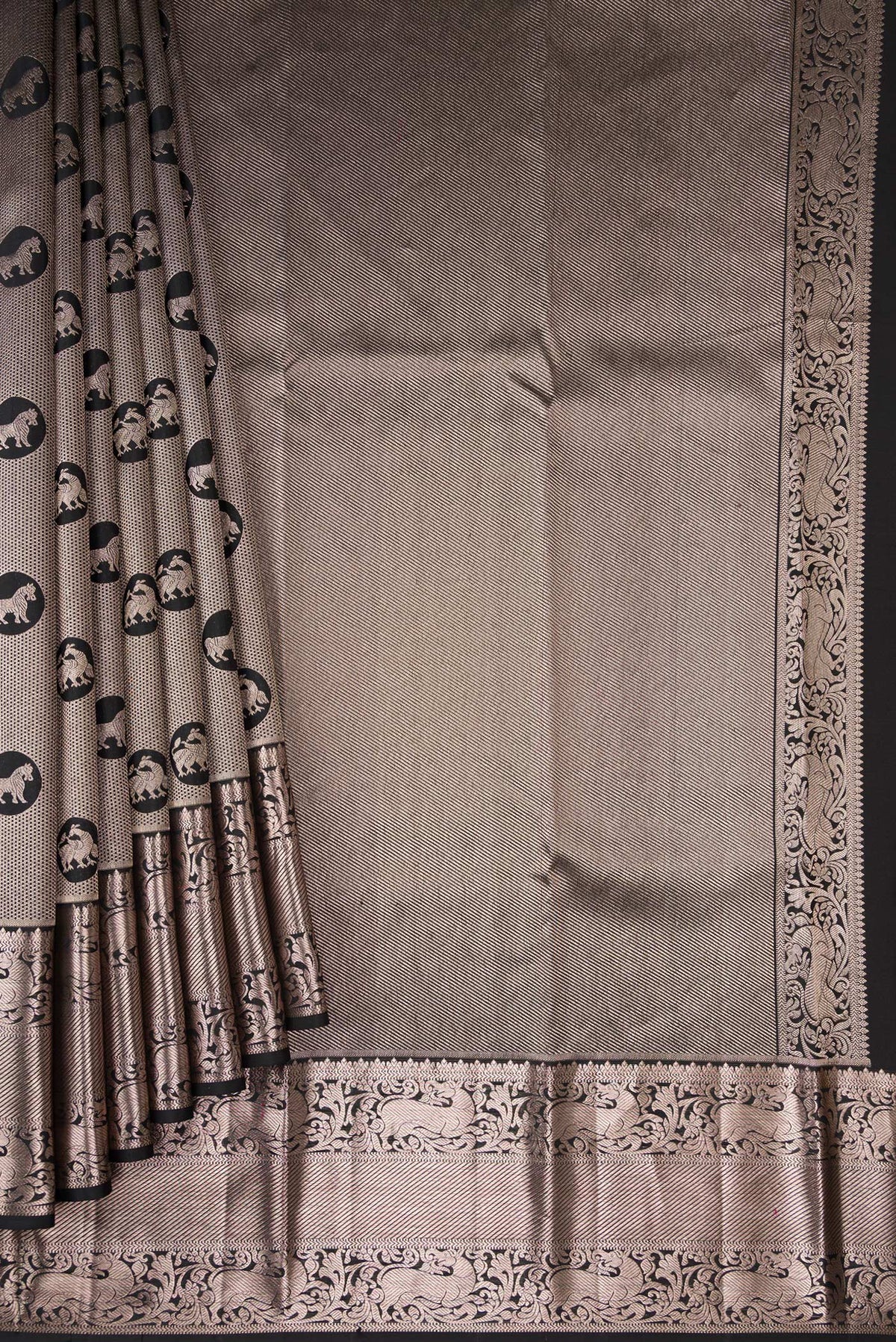 Pleats and pallu of Black Dual Tone Kanchipuram Silk Saree with Zari Brocade on the body and Zari Border. 