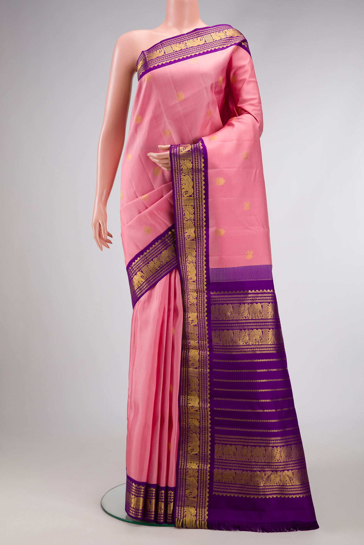 Pink Dual Tone Kanchipuram Silk Saree with Zari Butta on the body and Zari Border.  displayed on a mannequin