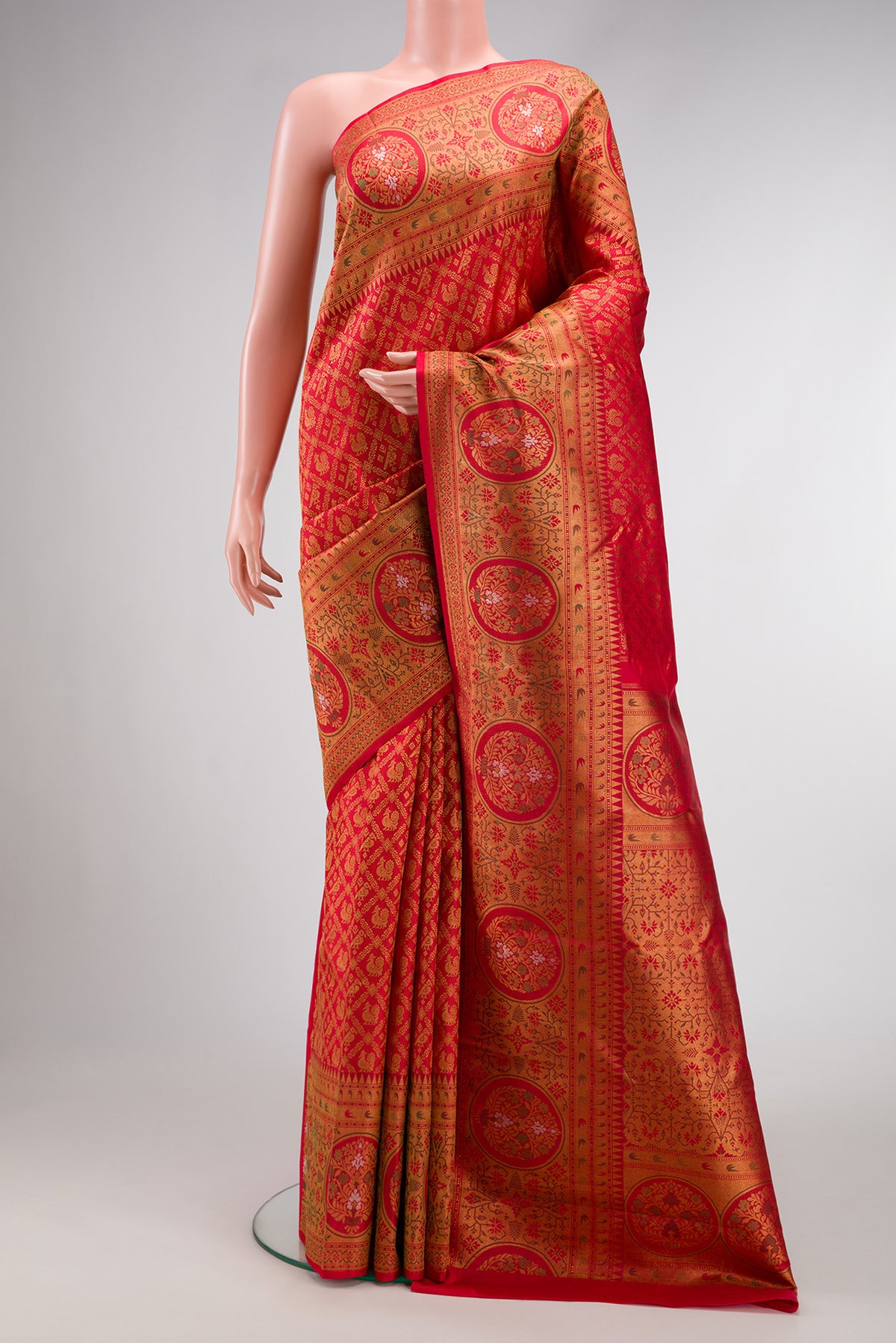 Red Dual Tone Kanjivaram Silk Saree with Zari Brocade on the body and Zari Border.  displayed on a mannequin