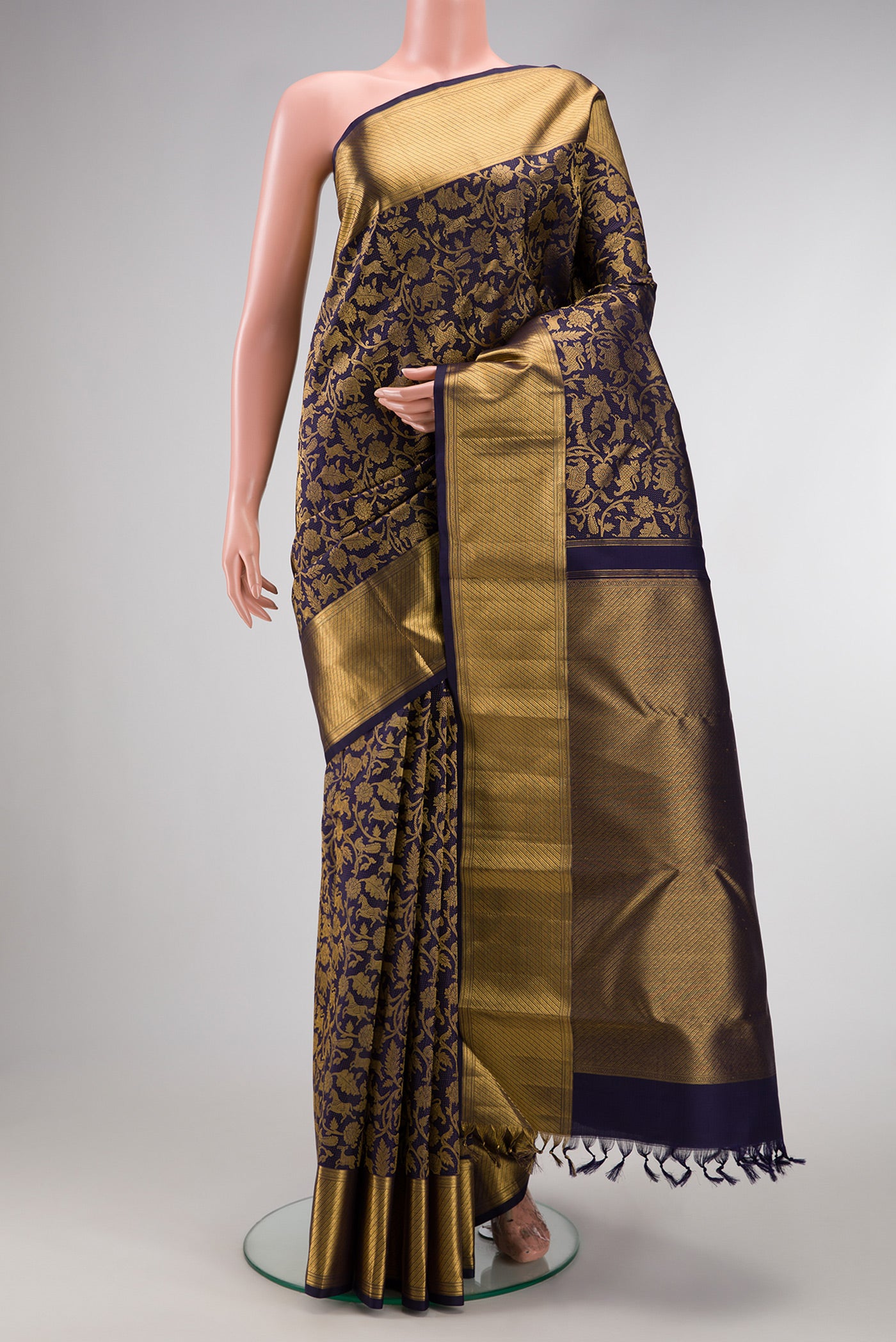 Navy Blue Dual Tone Kanchipuram Silk Saree with Zari Brocade on the body and Zari Border.  displayed on a mannequin
