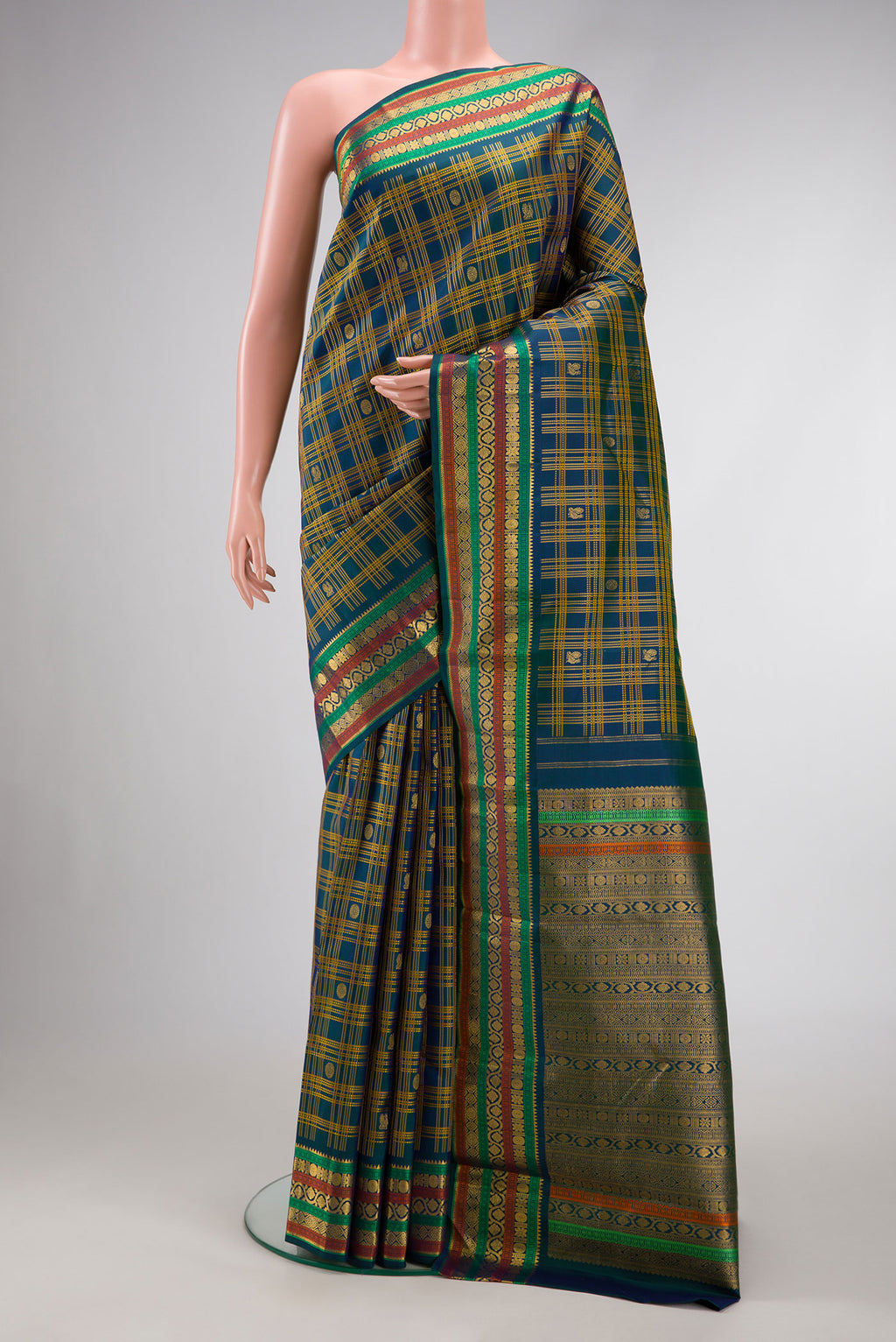 Pure Silk Pure Zari Navy Blue Dual Tone Kanjivaram Saree with Checked design on the body and Zari Border.  displayed on a mannequin
