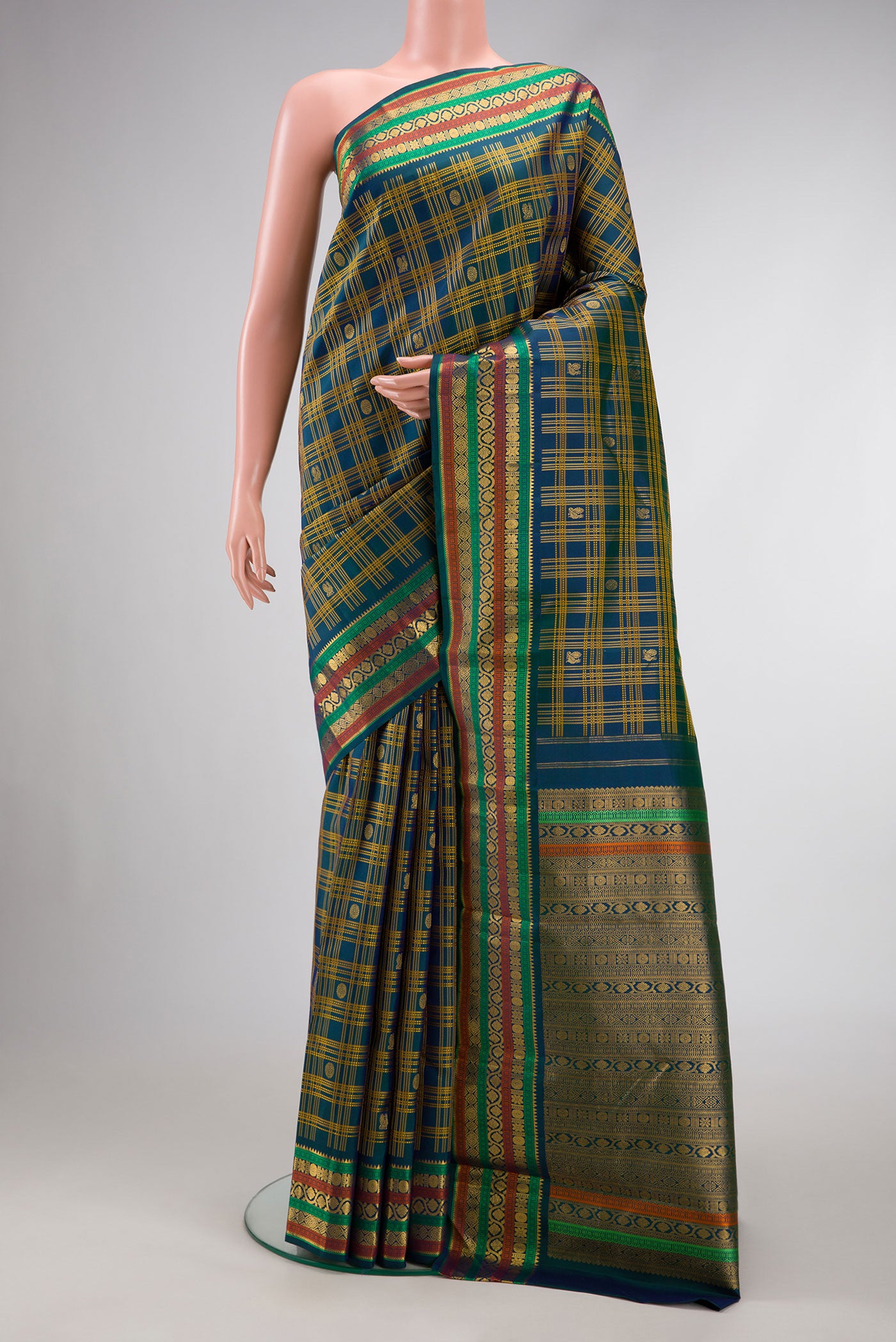 Pure Silk Pure Zari Navy Blue Dual Tone Kanjivaram Saree with Checked design on the body and Zari Border.  displayed on a mannequin