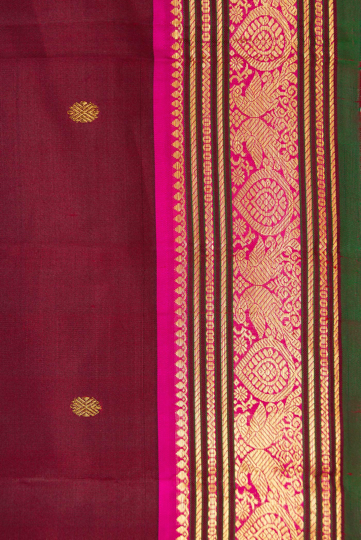 Border image of Maroon Dual Tone Kanjivaram Silk Saree with Zari Butta on the body and Zari Border. 