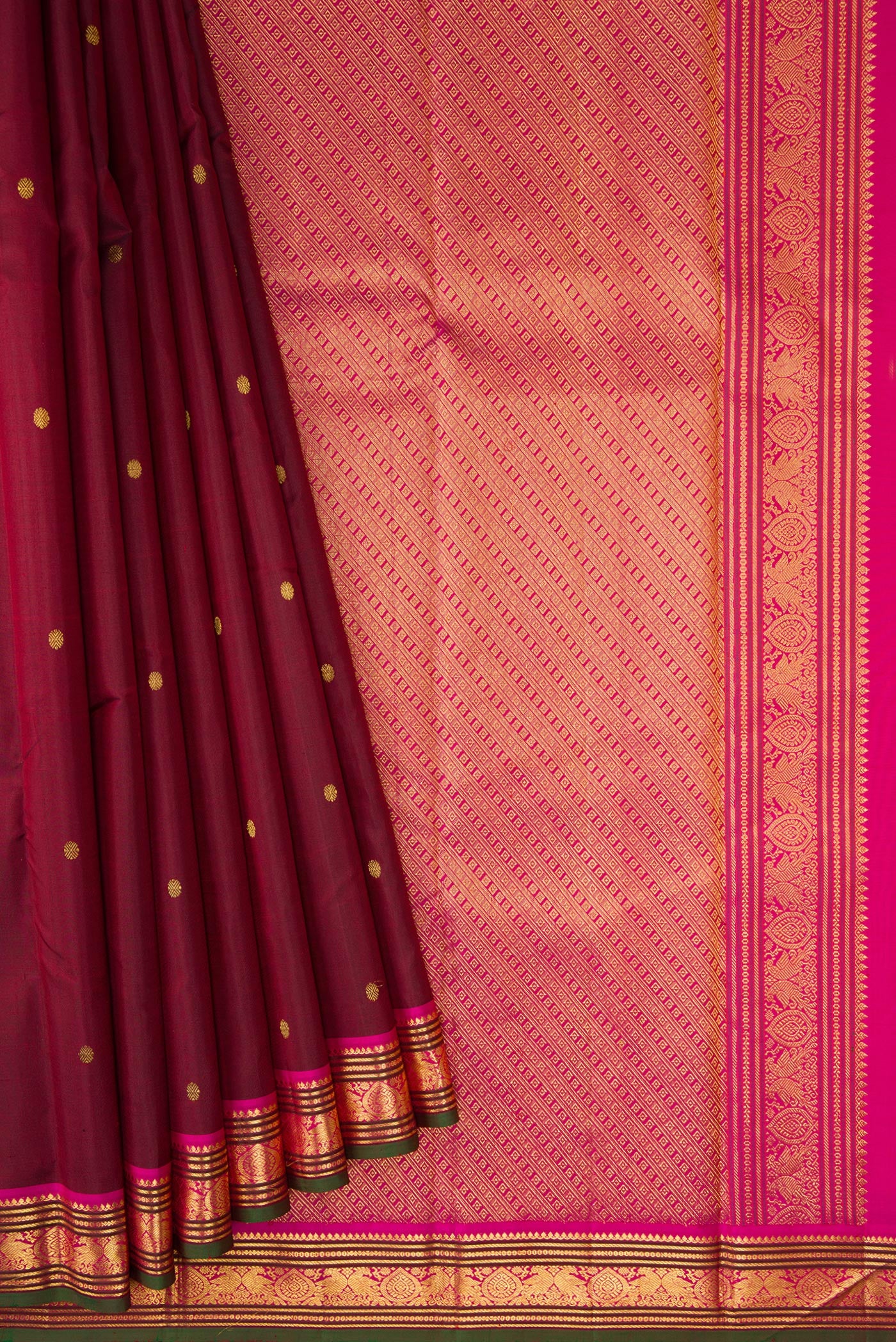 Pleats and pallu of Maroon Dual Tone Kanjivaram Silk Saree with Zari Butta on the body and Zari Border. 