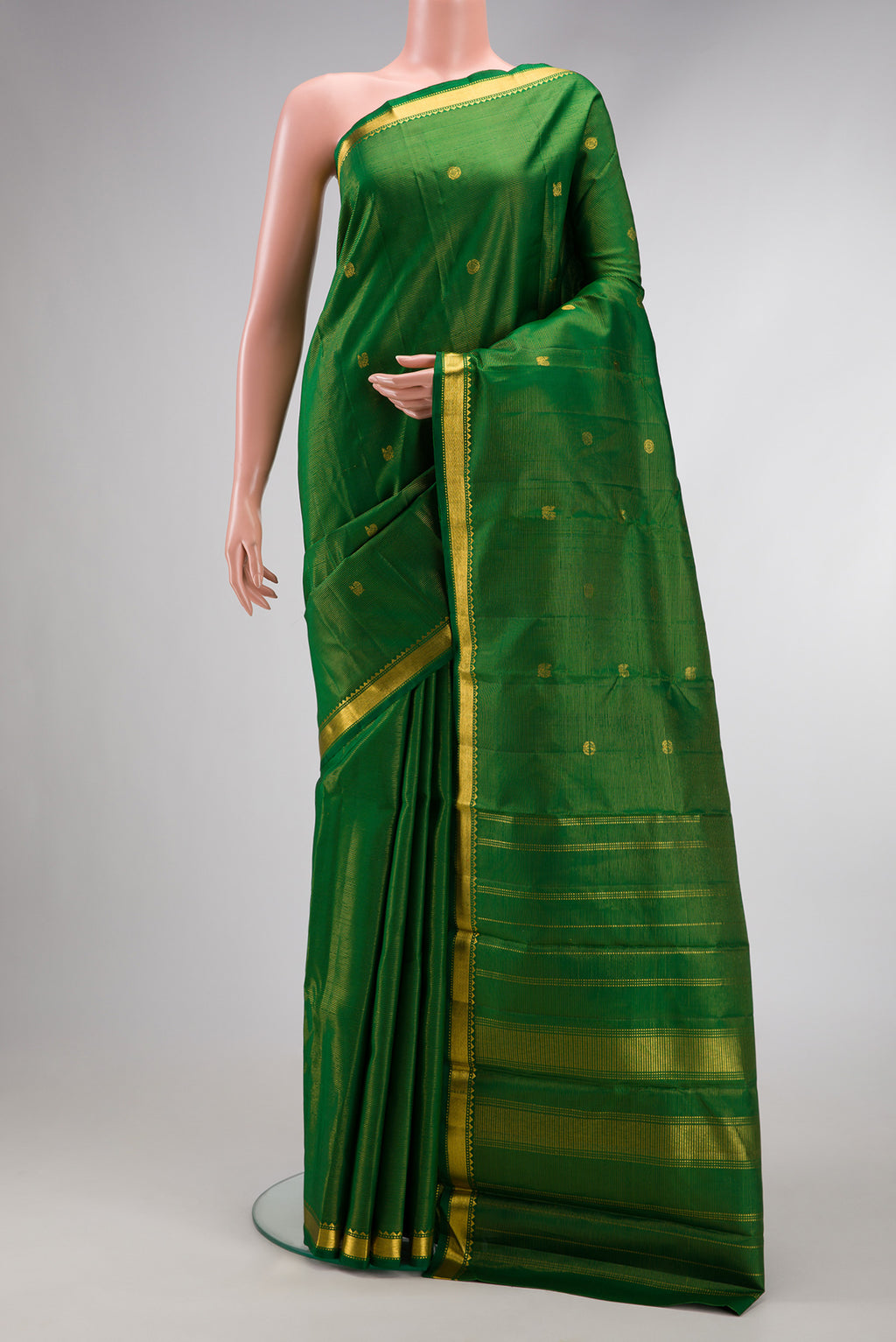 Pure Silk Pure Zari Green Dual Tone Kanjivaram Saree with Stripes on the body and Zari Border.  displayed on a mannequin