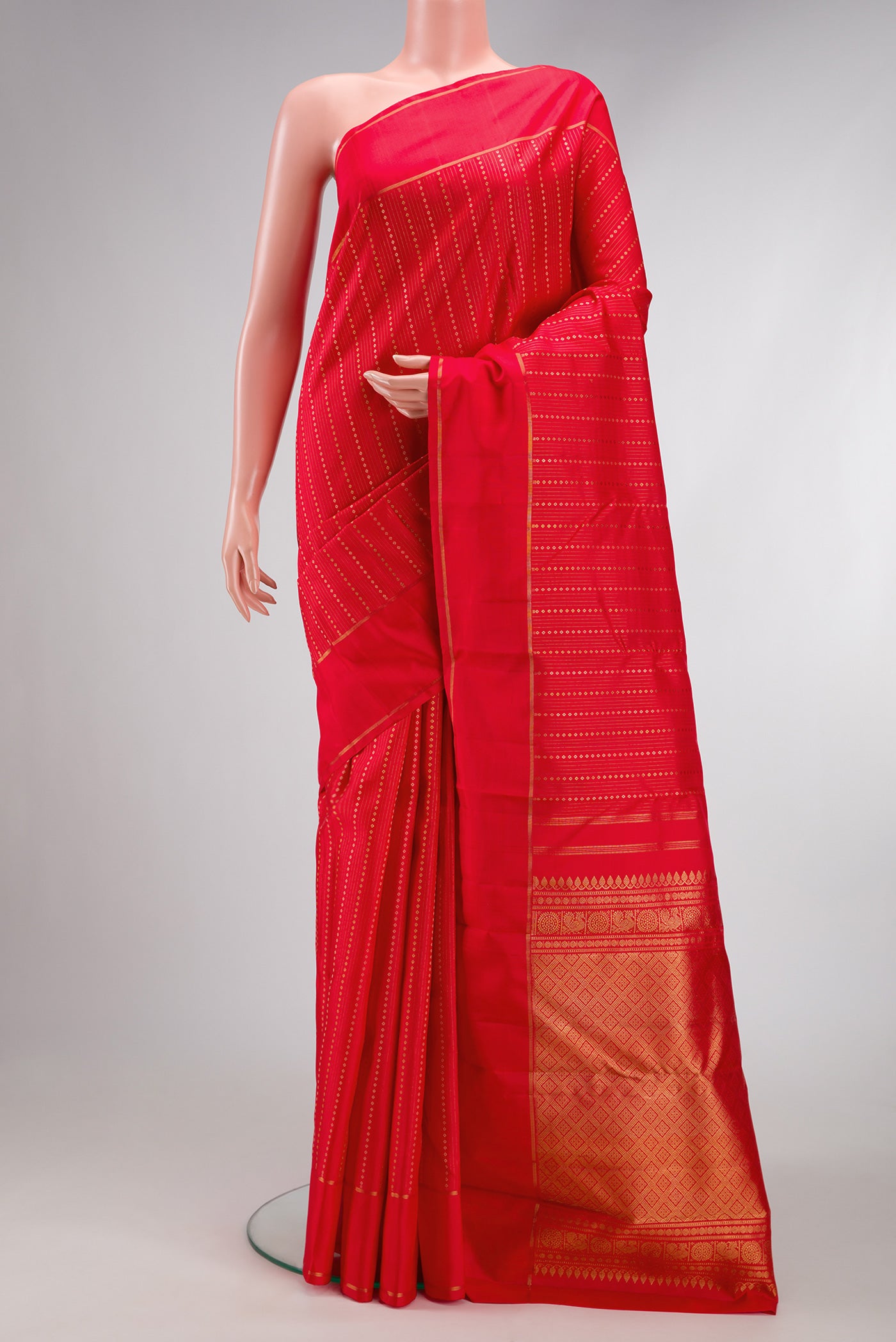 Pure Silk Pure Zari Red Dual Tone Kanchipuram Saree with Stripes on the body and Zari Border.  displayed on a mannequin