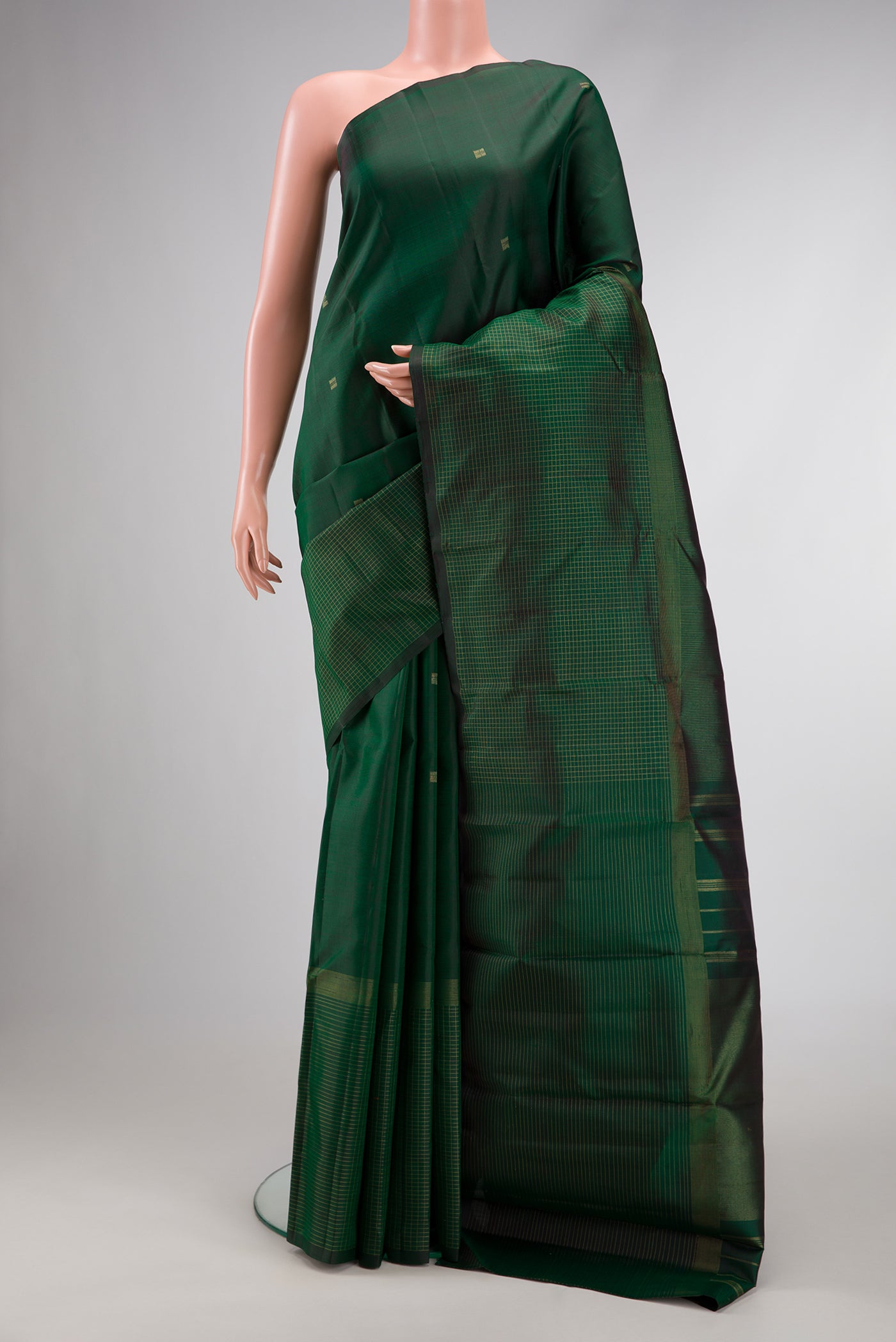 Pure Silk Pure Zari Bottle Green Dual Tone Kanchipuram Saree with Zari Butta on the body and Fancy Border.  displayed on a mannequin