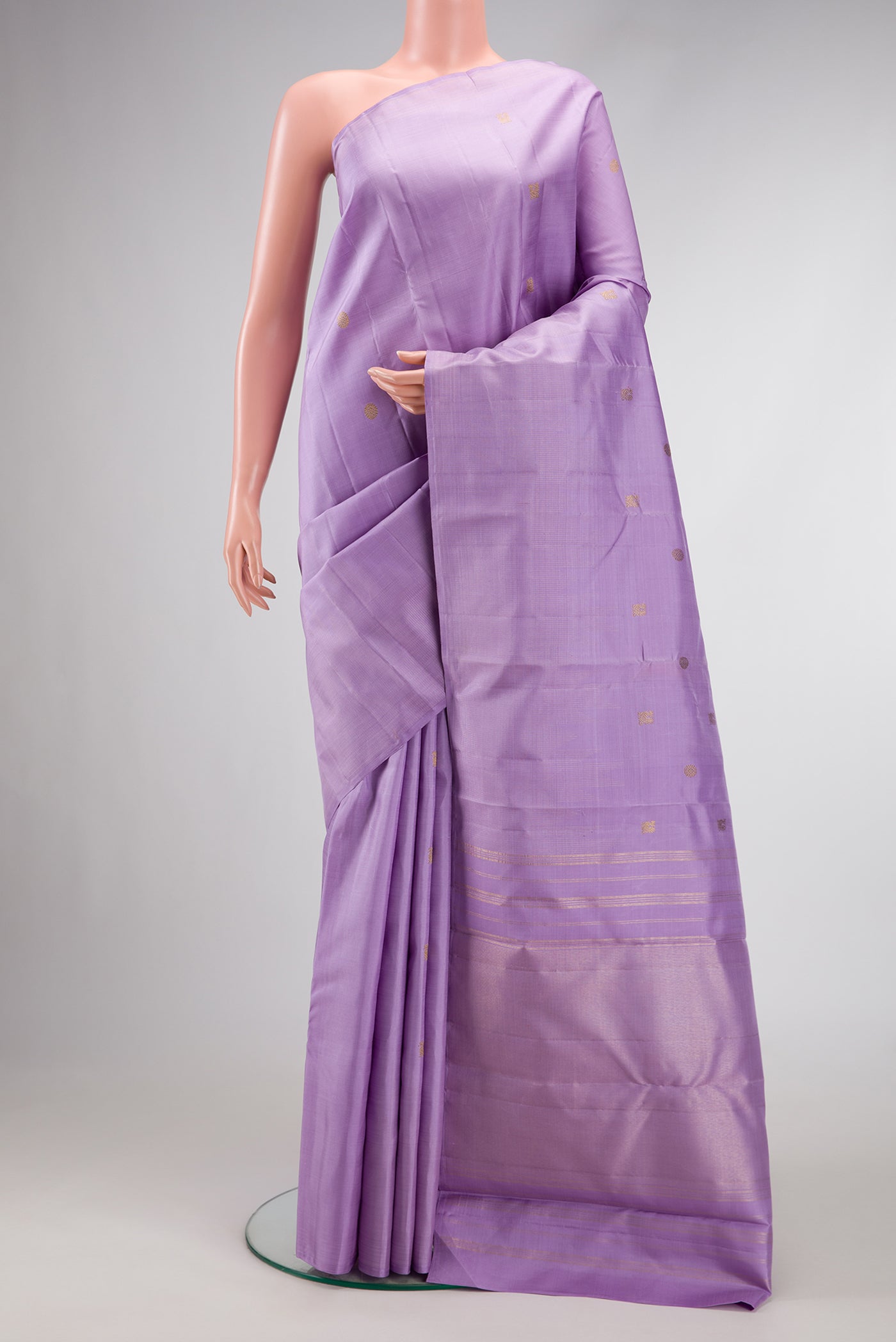 Pure Silk Pure Zari Lavender Dual Tone Kanchipuram Saree with Zari Butta on the body and Temple Border.  displayed on a mannequin