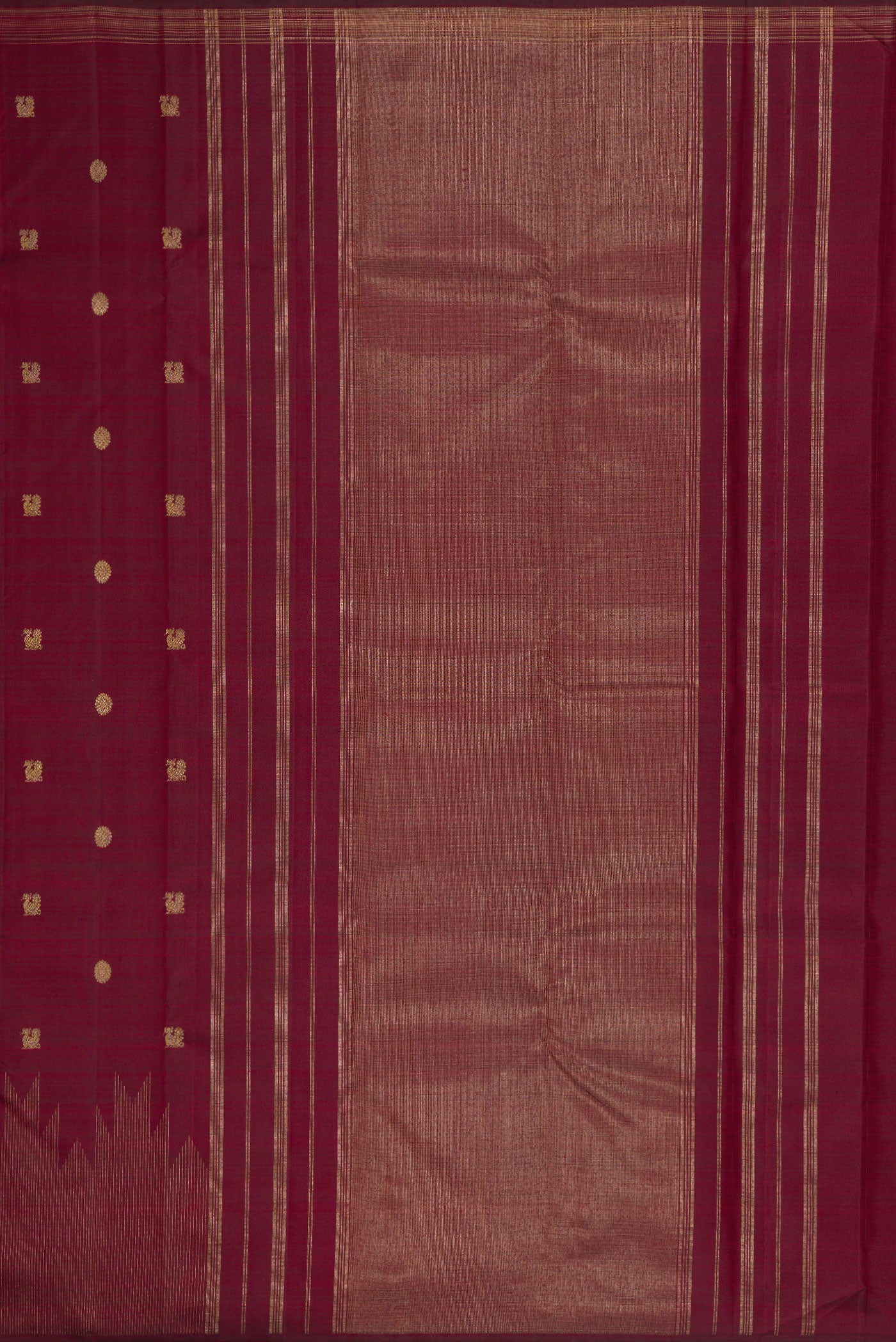 Close up image of the pallu of Pure Silk Pure Zari Maroon Dual Tone Kanchipuram Saree with Zari Butta on the body and Zari Border. 