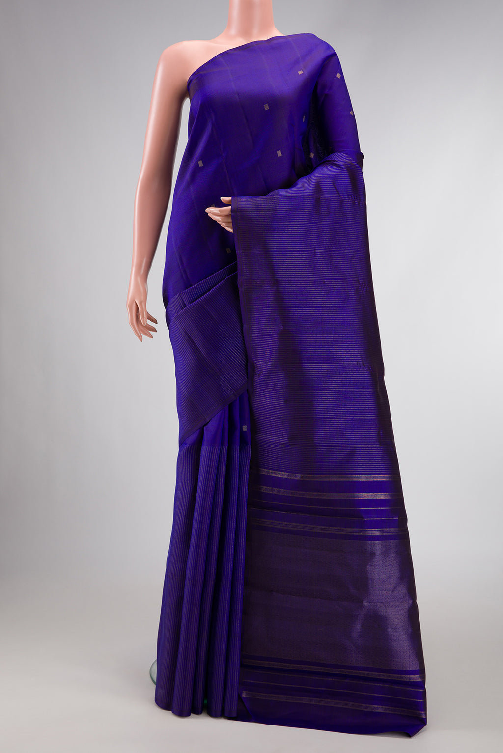 Pure Silk Pure Zari Royal Blue Dual Tone Kanchipuram Saree with Half And Half on the body and Without Border.  displayed on a mannequin