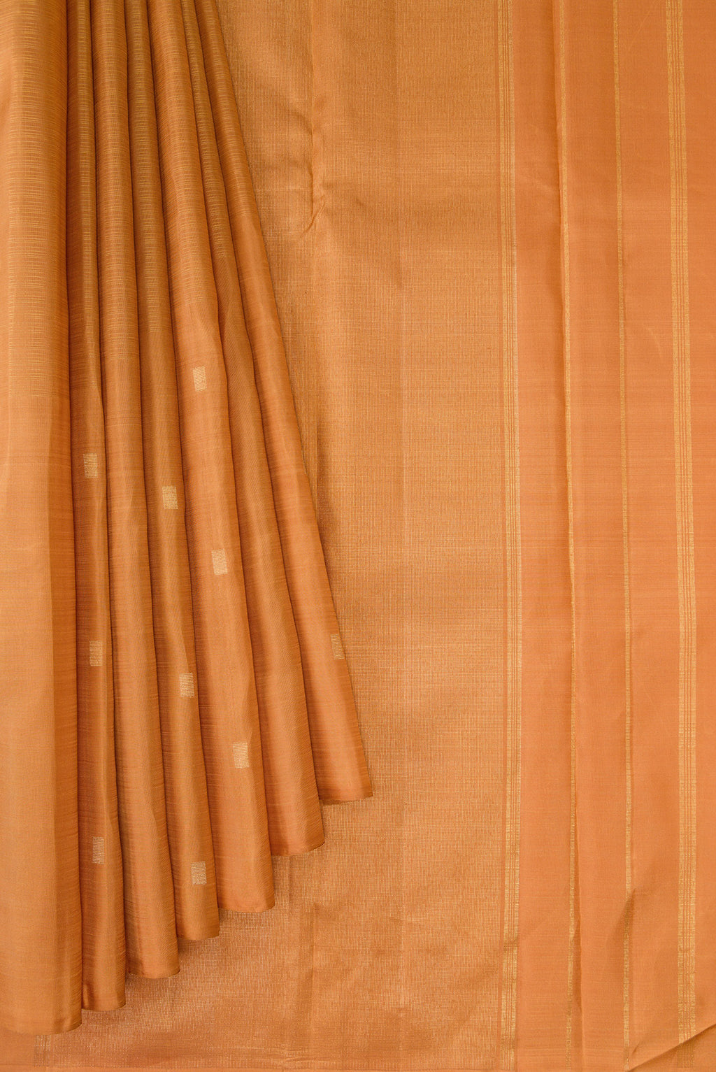 Pleats and pallu of Pure Silk Pure Zari Golden Dual Tone Kanchipuram Saree with Zari Butta on the body and Without Border. 