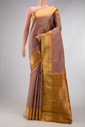 Pure Silk Pure Zari Rose Gold Kanjivaram Saree with Zari Butta on the body and Zari Border.  displayed on a mannequin