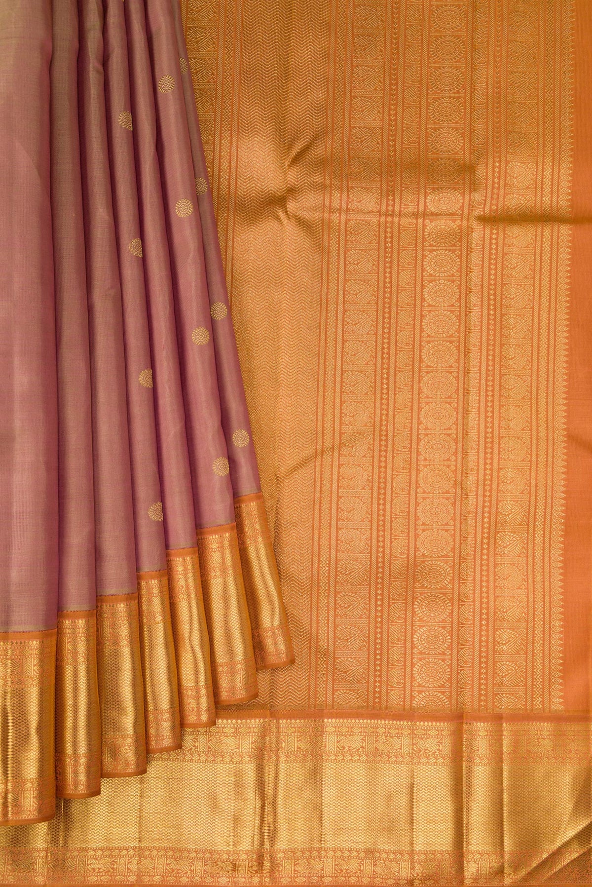 Pleats and pallu of Pure Silk Pure Zari Rose Gold Kanjivaram Saree with Zari Butta on the body and Zari Border. 