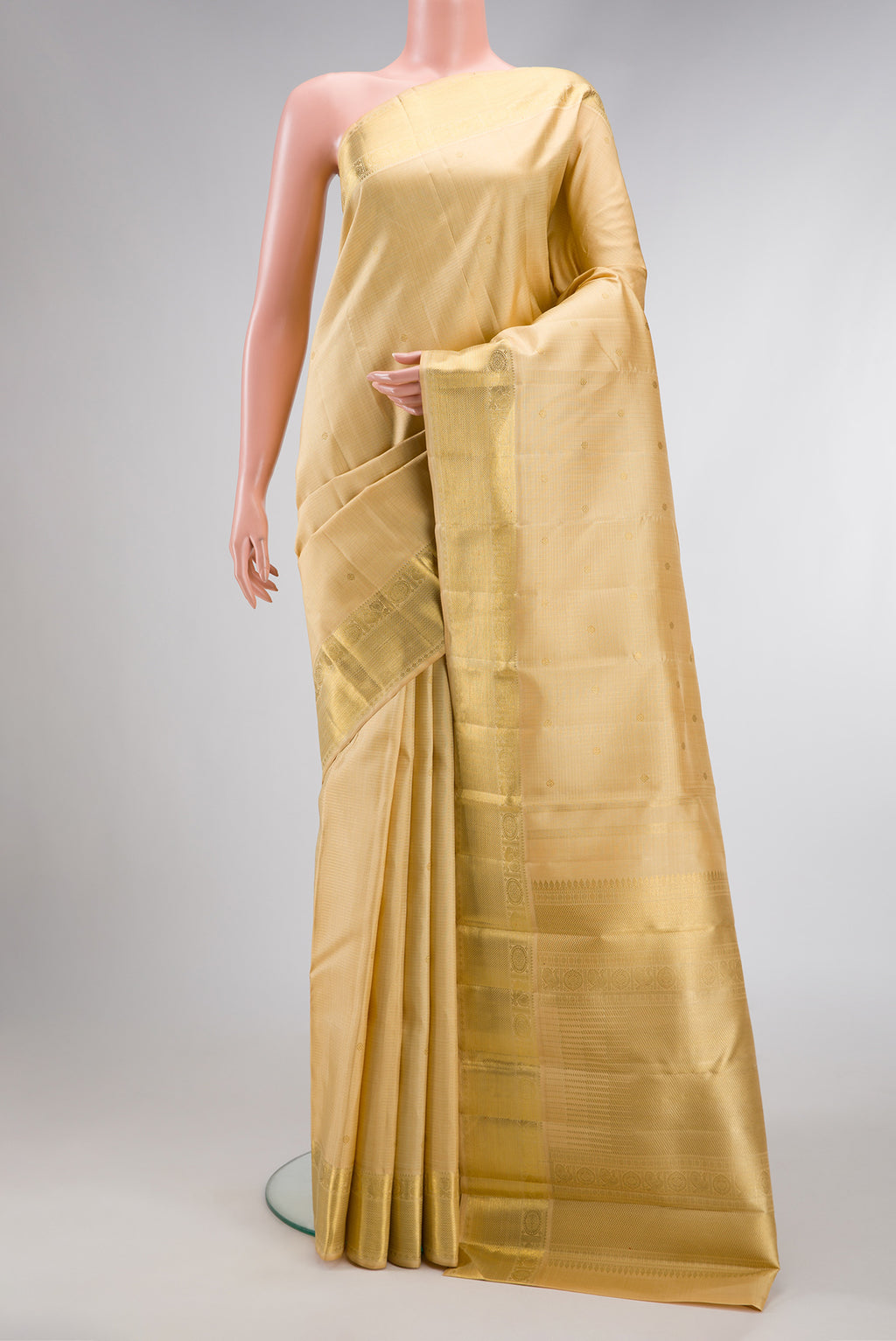 Pure Silk Pure Zari Sandal Dual Tone Kanjivaram Saree with Zari Butta on the body and Zari Border.  displayed on a mannequin