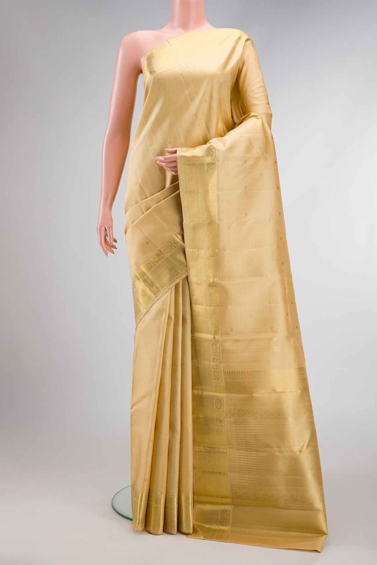 Pure Silk Pure Zari Sandal Dual Tone Kanjivaram Saree with Zari Butta on the body and Zari Border.  displayed on a mannequin