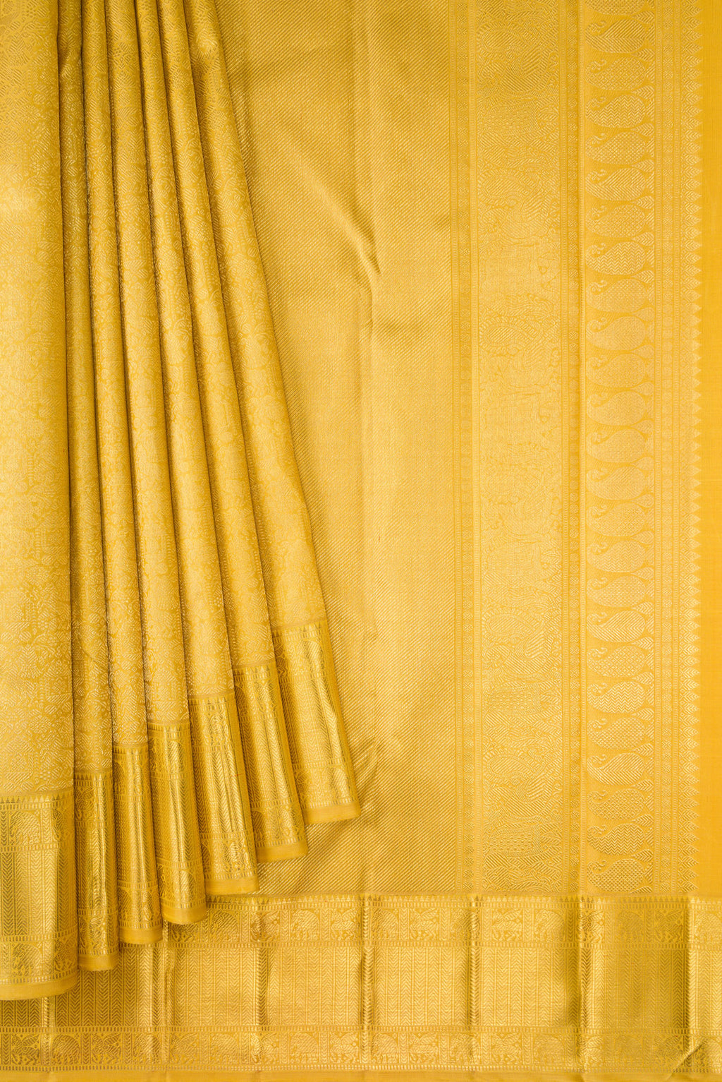 Pleats and pallu of Pure Silk Pure Zari Mustard Dual Tone Kanjivaram Saree with Zari Brocade on the body and Zari Border. 