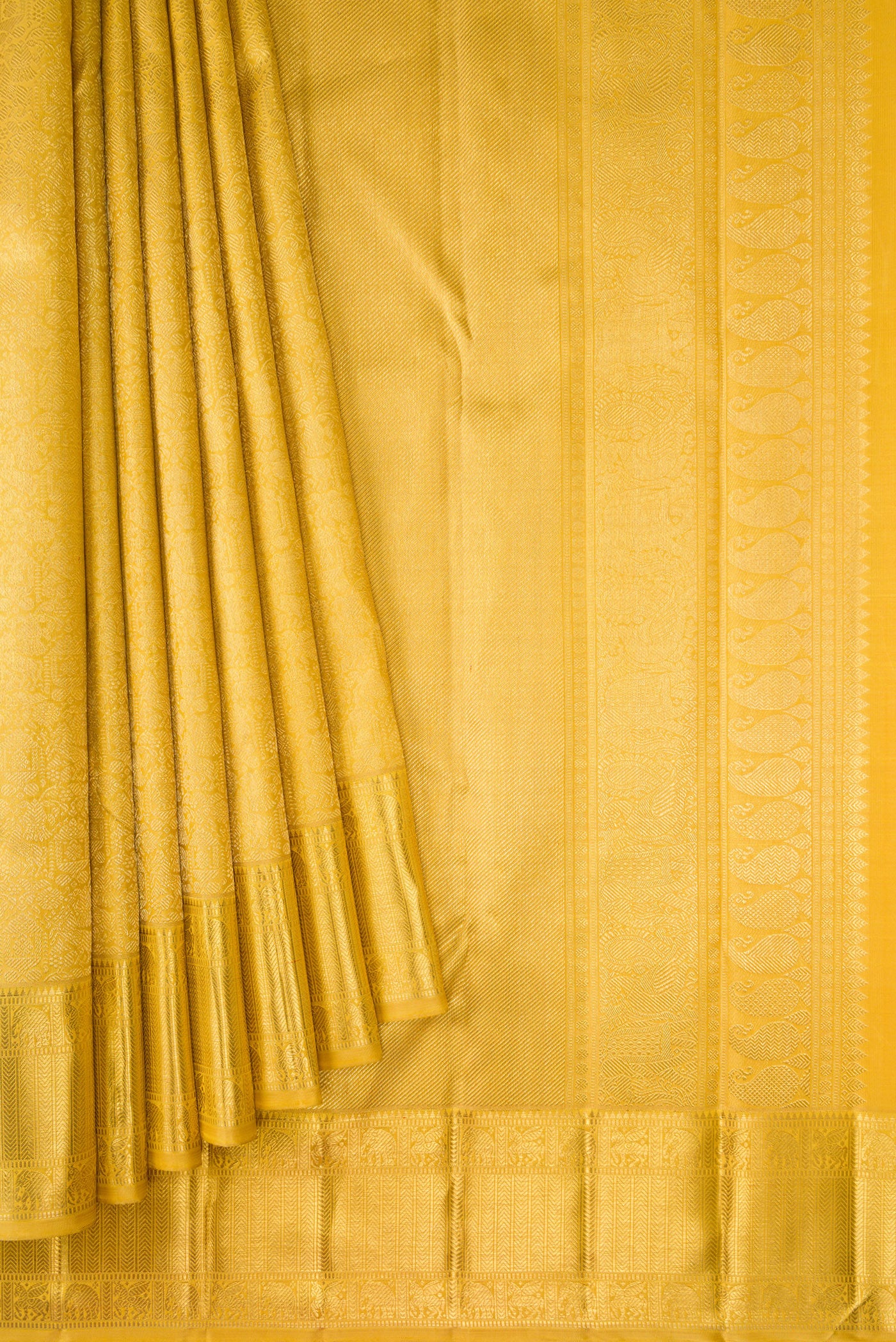 Pleats and pallu of Pure Silk Pure Zari Mustard Dual Tone Kanjivaram Saree with Zari Brocade on the body and Zari Border. 